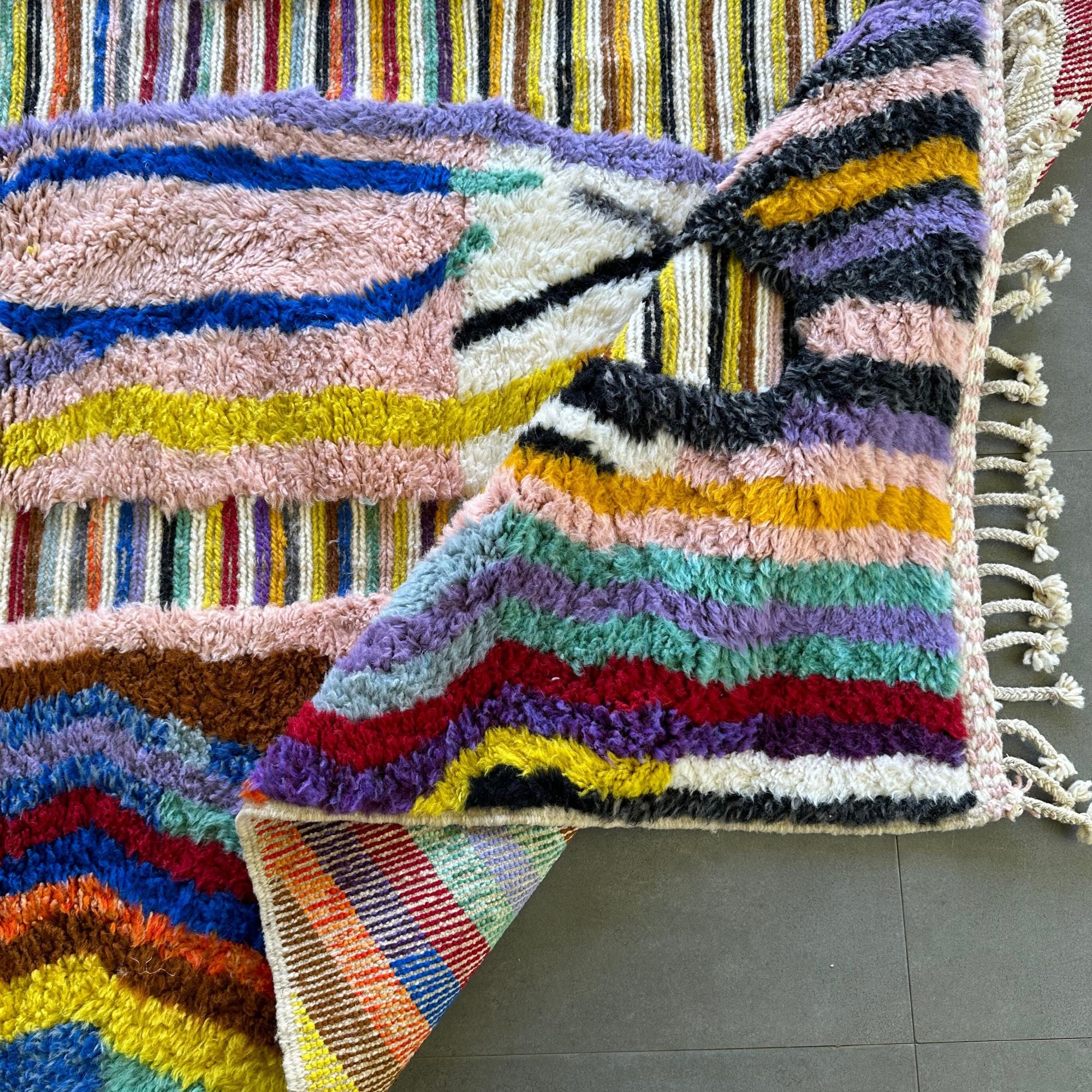 Berber Odyssey Berber area rug in stock with a vibrant multicolor and textured design, handwoven by Berber artisans