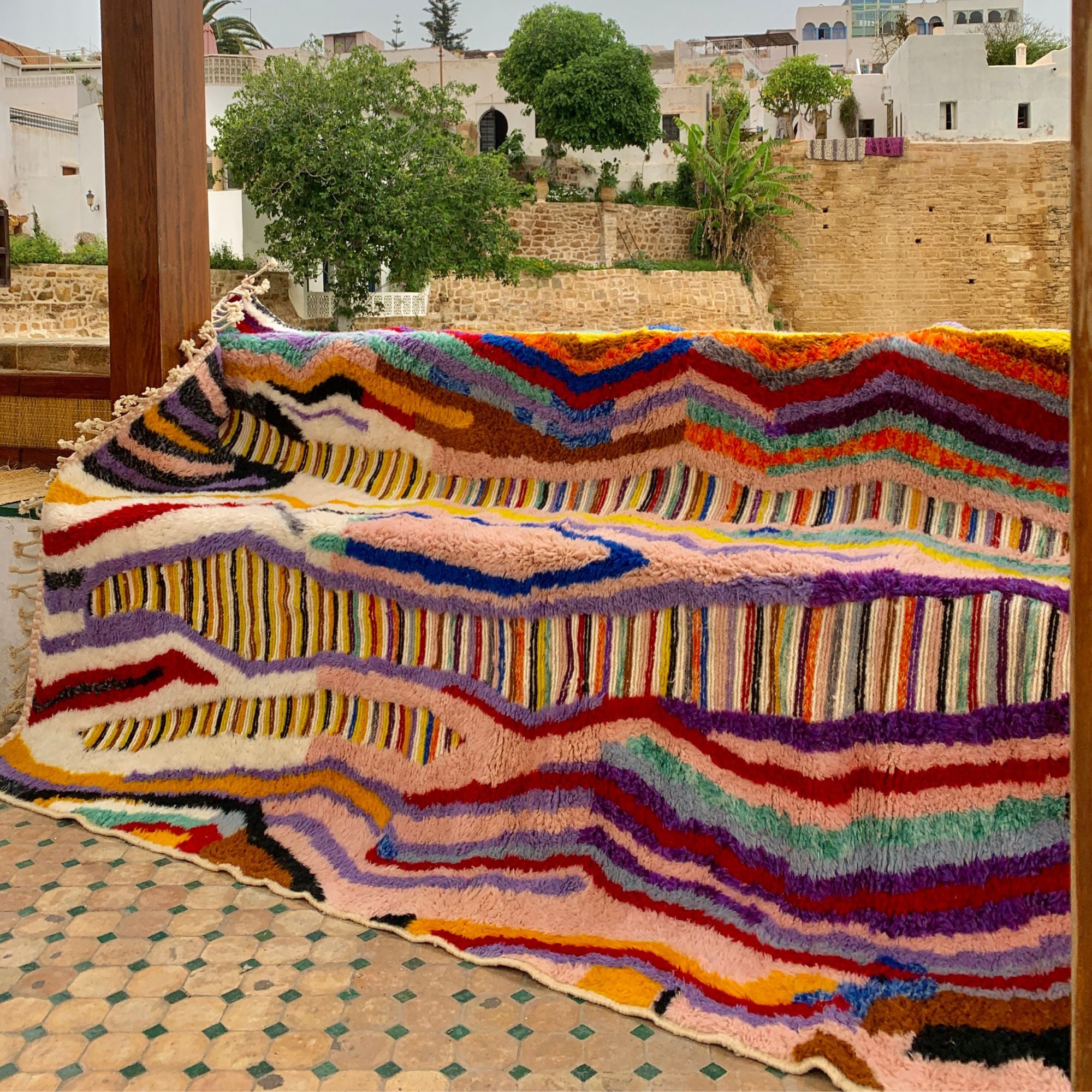 Berber Odyssey Berber area rug in stock with a vibrant multicolor and textured design, handwoven by Berber artisans