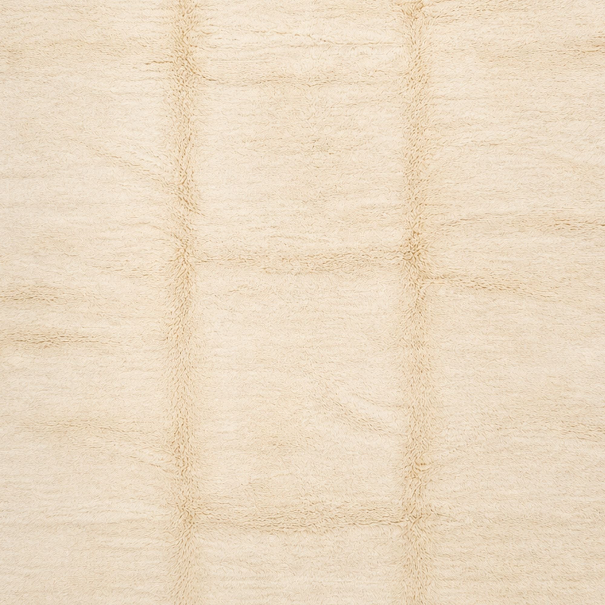 Close-up of Épure cream Moroccan rug showing plush high pile and subtle tonal variations in natural wool