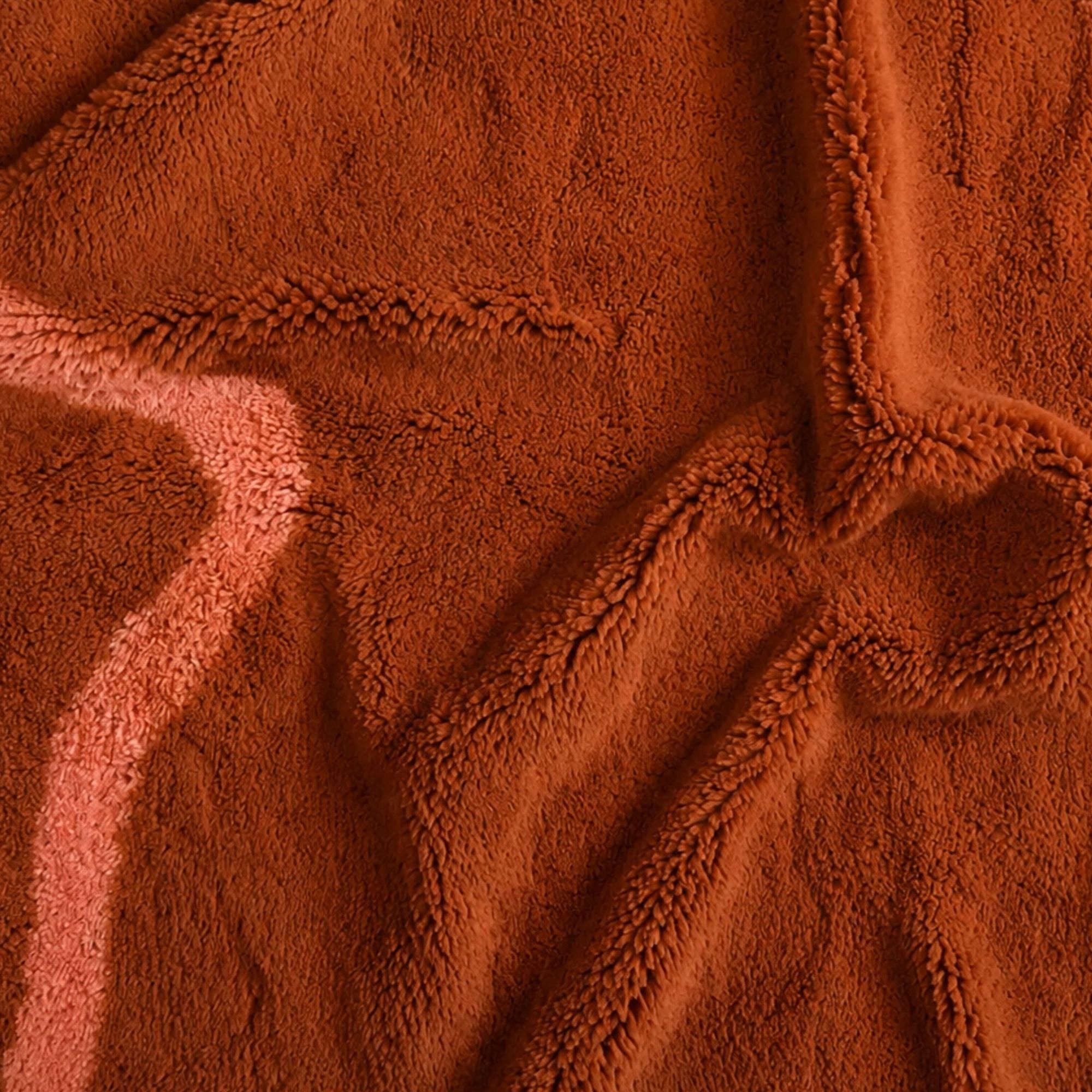 Close-up of Marea No. 01 terracotta Moroccan wool rug with blush pink line