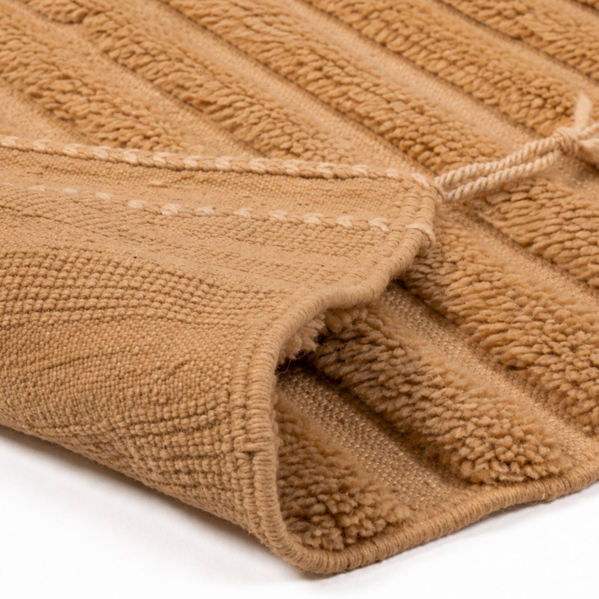 Close-up of Strata No. 02 Moroccan rug showing layered weave, plush wool texture and warm camel color