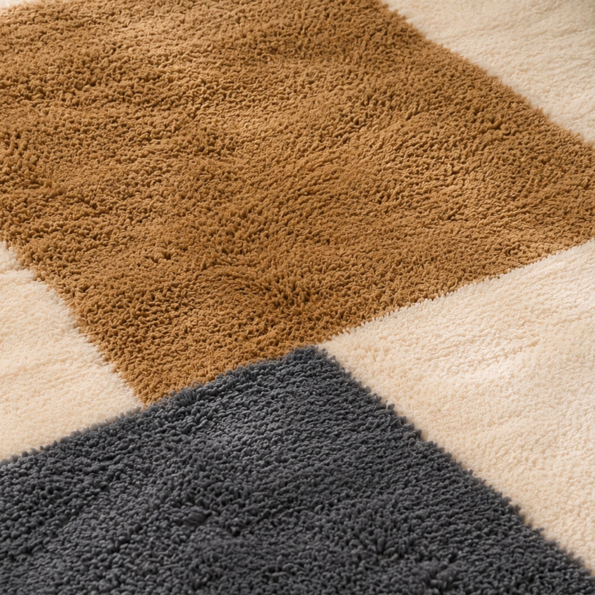 Close-up of charcoal and ivory handmade Moroccan wool rug with hand-finished fringe