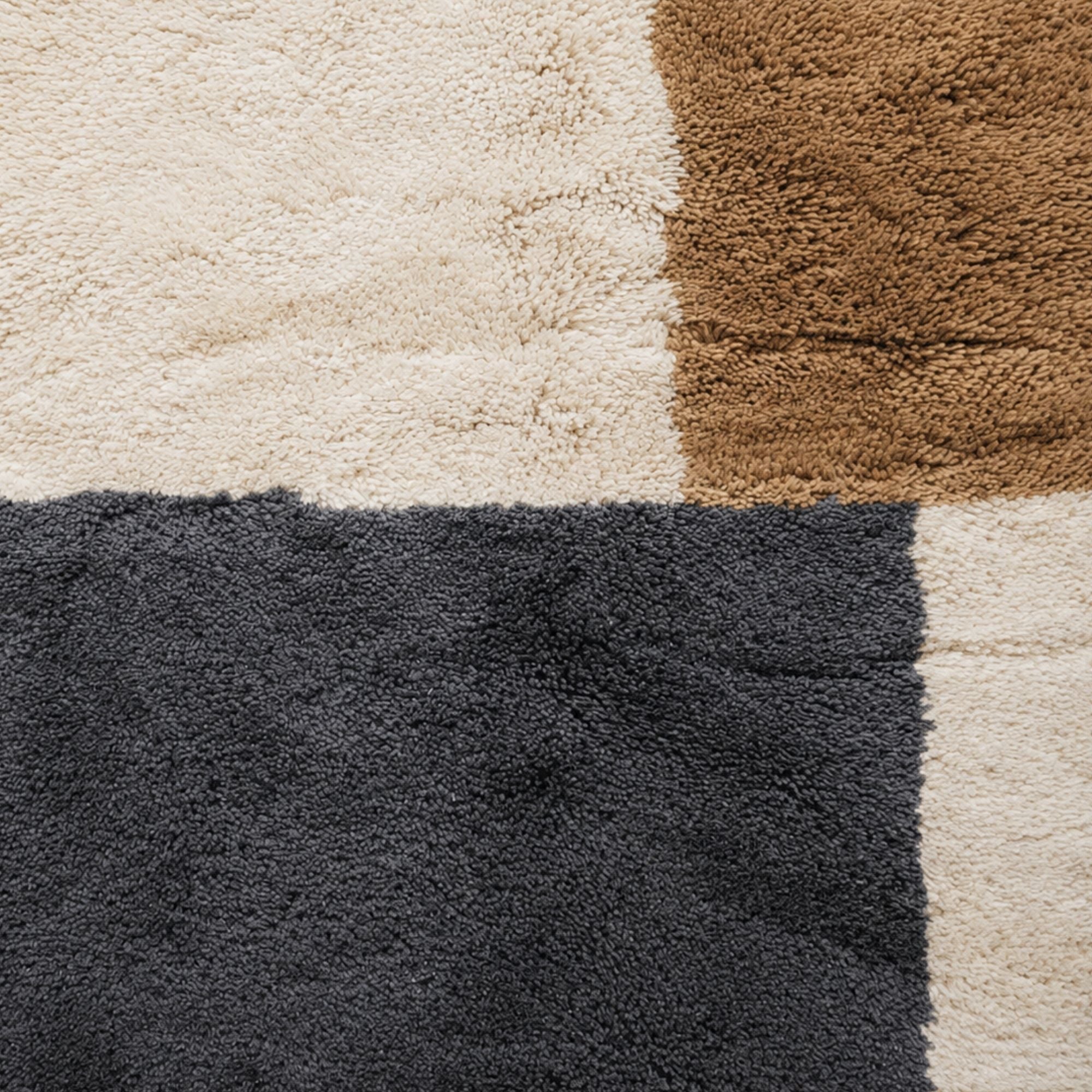 Close-up texture of contemporary geometric Moroccan wool rug in neutral colors
