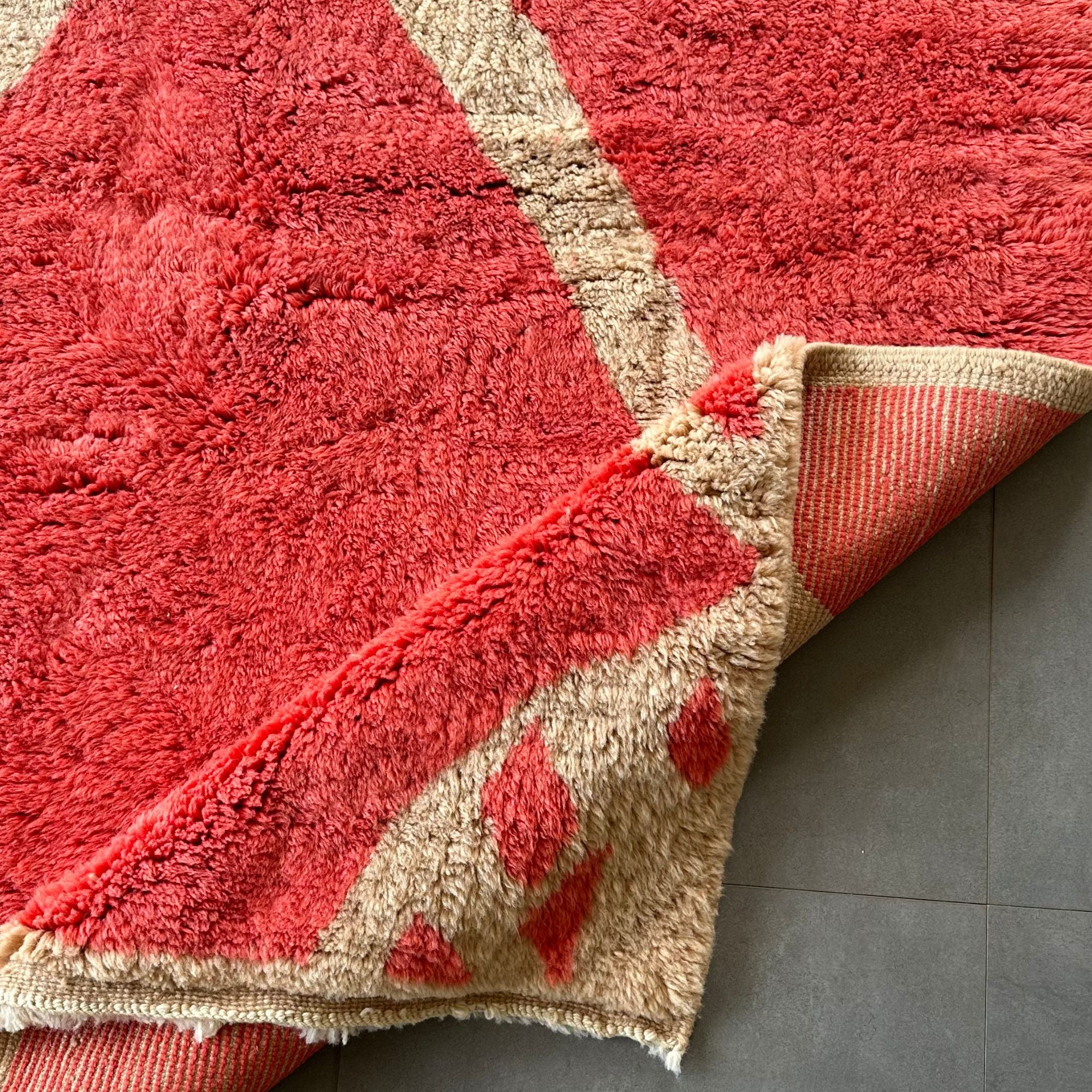 Detailed shot of the artisan craftsmanship in Berber rug weaving.