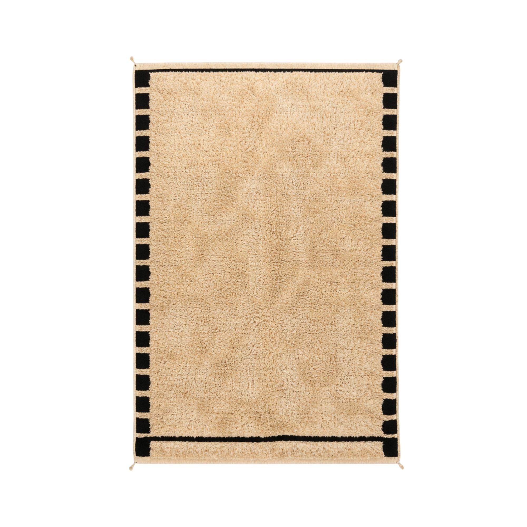 Handwoven Cadence Moroccan rug in natural ivory wool with bold black geometric border and plush high pile texture.