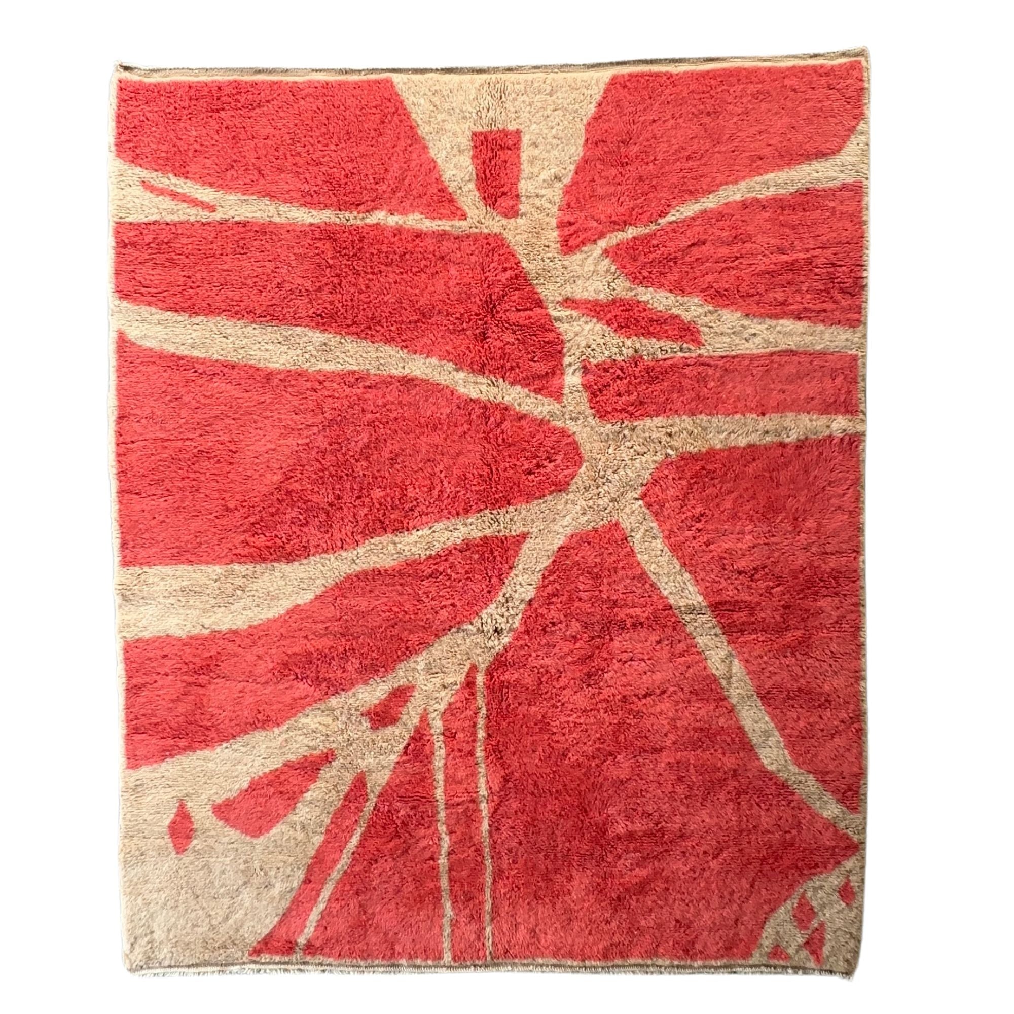 Handwoven Moroccan area rug with red and cream geometric design.