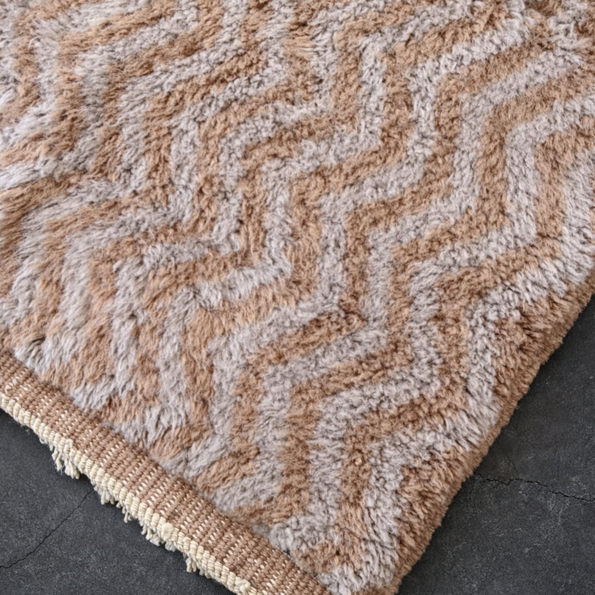 Handwoven Moroccan wool rug, Haze design, hand-knotted pile with cream fringe edge detail.