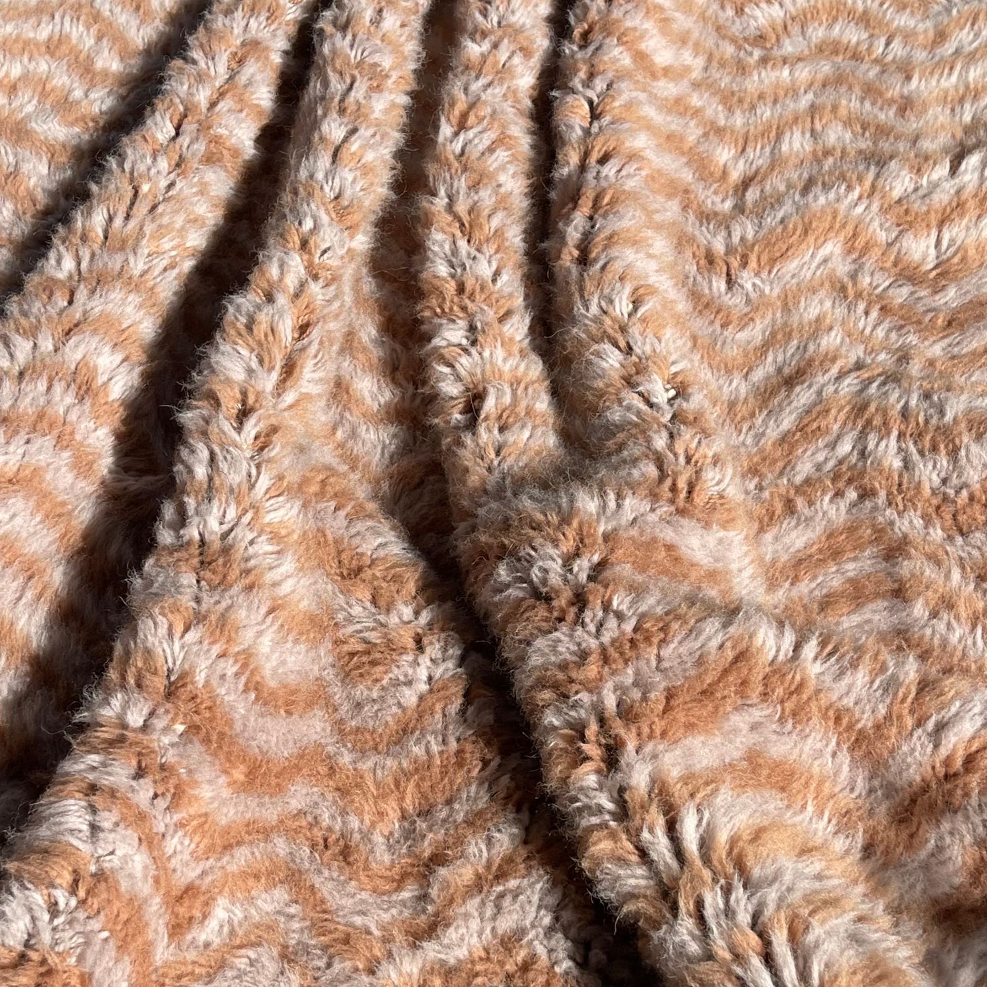 Handwoven Moroccan wool rug, Haze design styled in a warm living room setting, high-pile texture.
