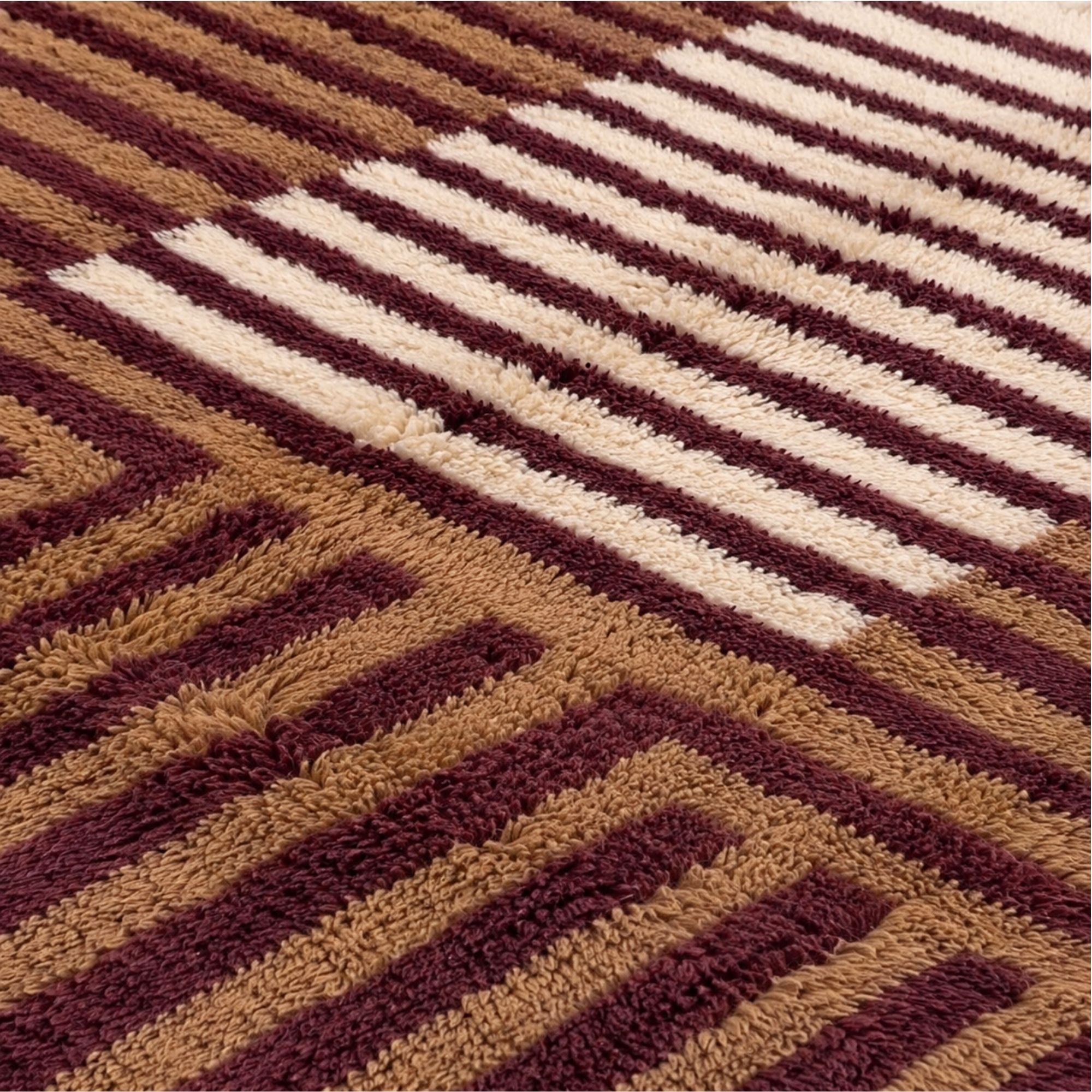 Handwoven Moroccan wool rug, Lattice design, close-up of rotating stripe direction and pile texture.