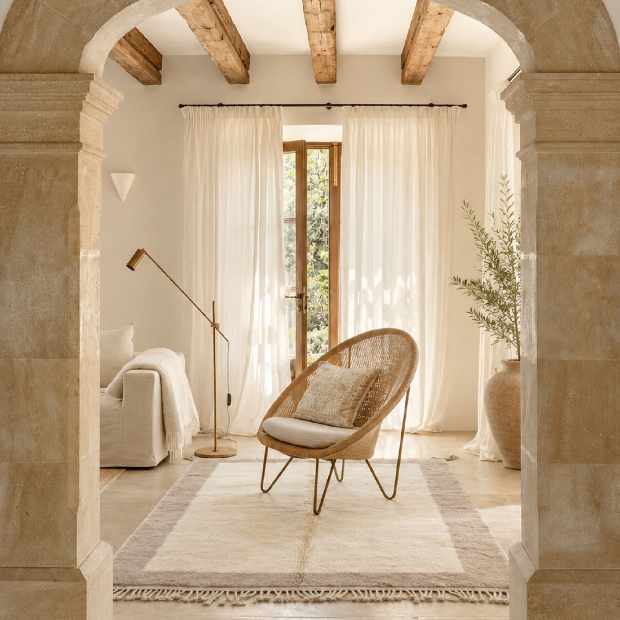 Handwoven Moroccan wool rug, Meridian design styled in a sunlit neutral living room.
