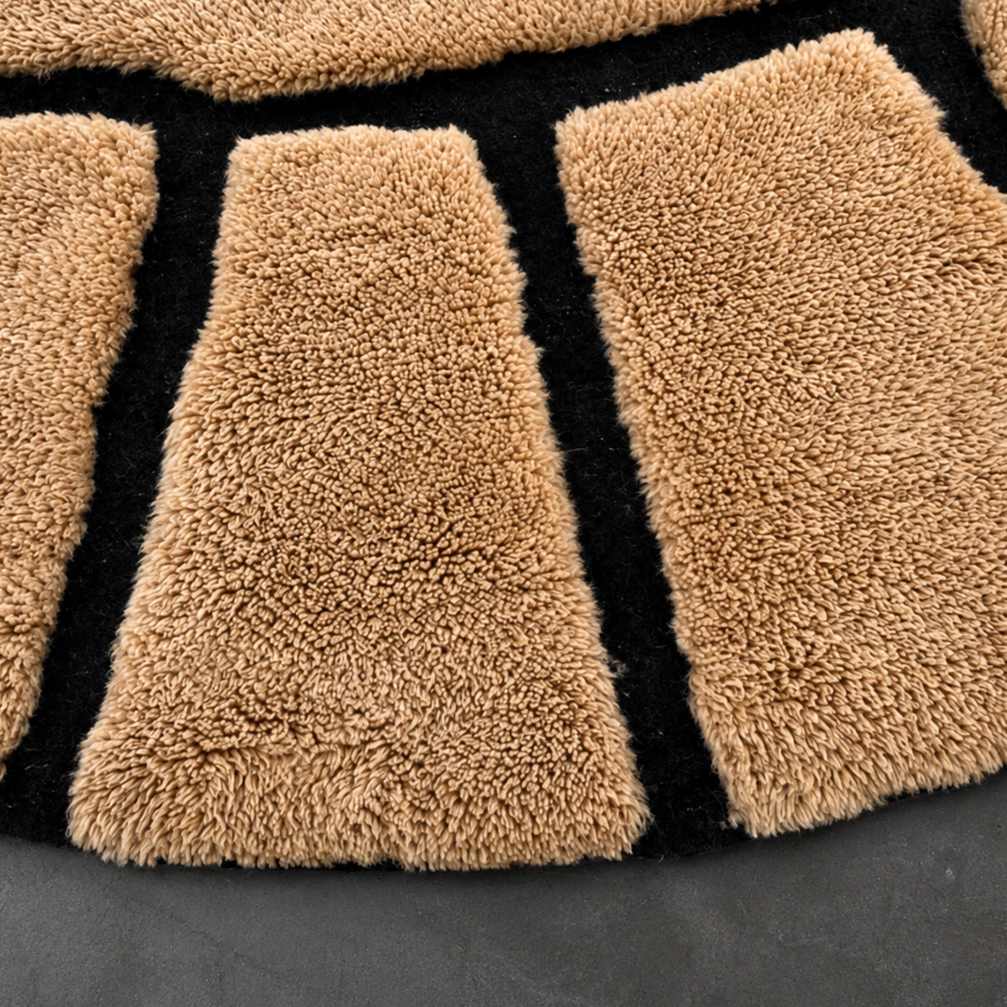 Handwoven Moroccan wool rug, Compass design, close-up of radiating panel segments and high-pile texture.
