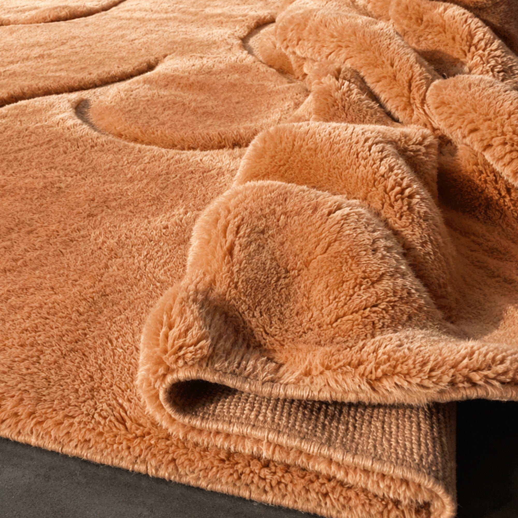 Handwoven Moroccan wool rug, Contour No. 02 design, corner detail showing carved relief and folded pile texture.