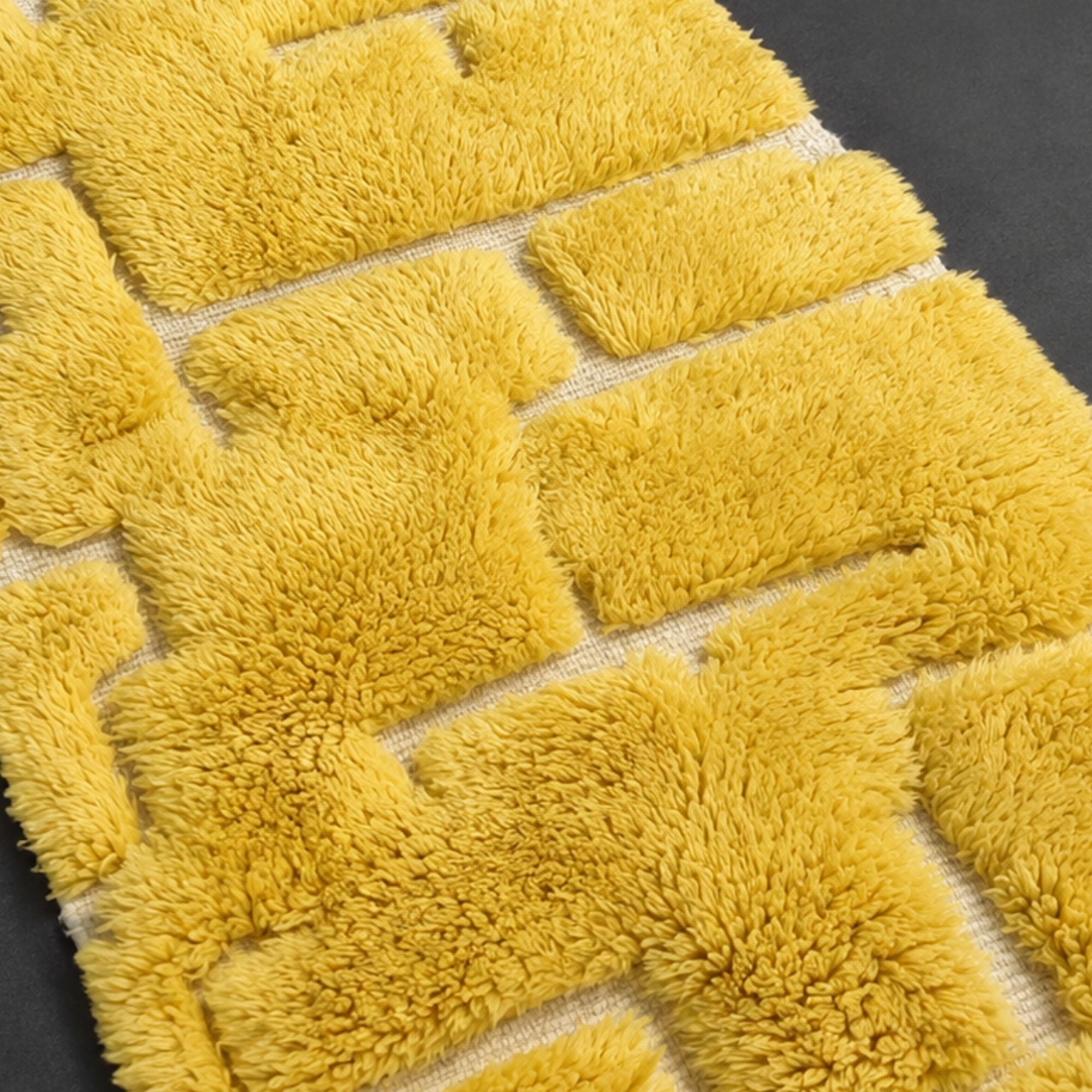 Handwoven Moroccan wool rug, Solarium design, close-up of staggered yellow block texture and pile detail.