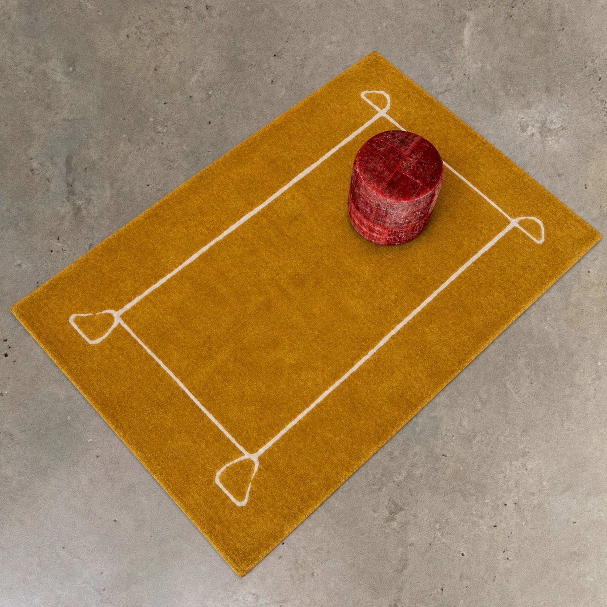 Saffron Moroccan rug with ivory geometric frame, modern living space styling, handmade wool Berber rug
