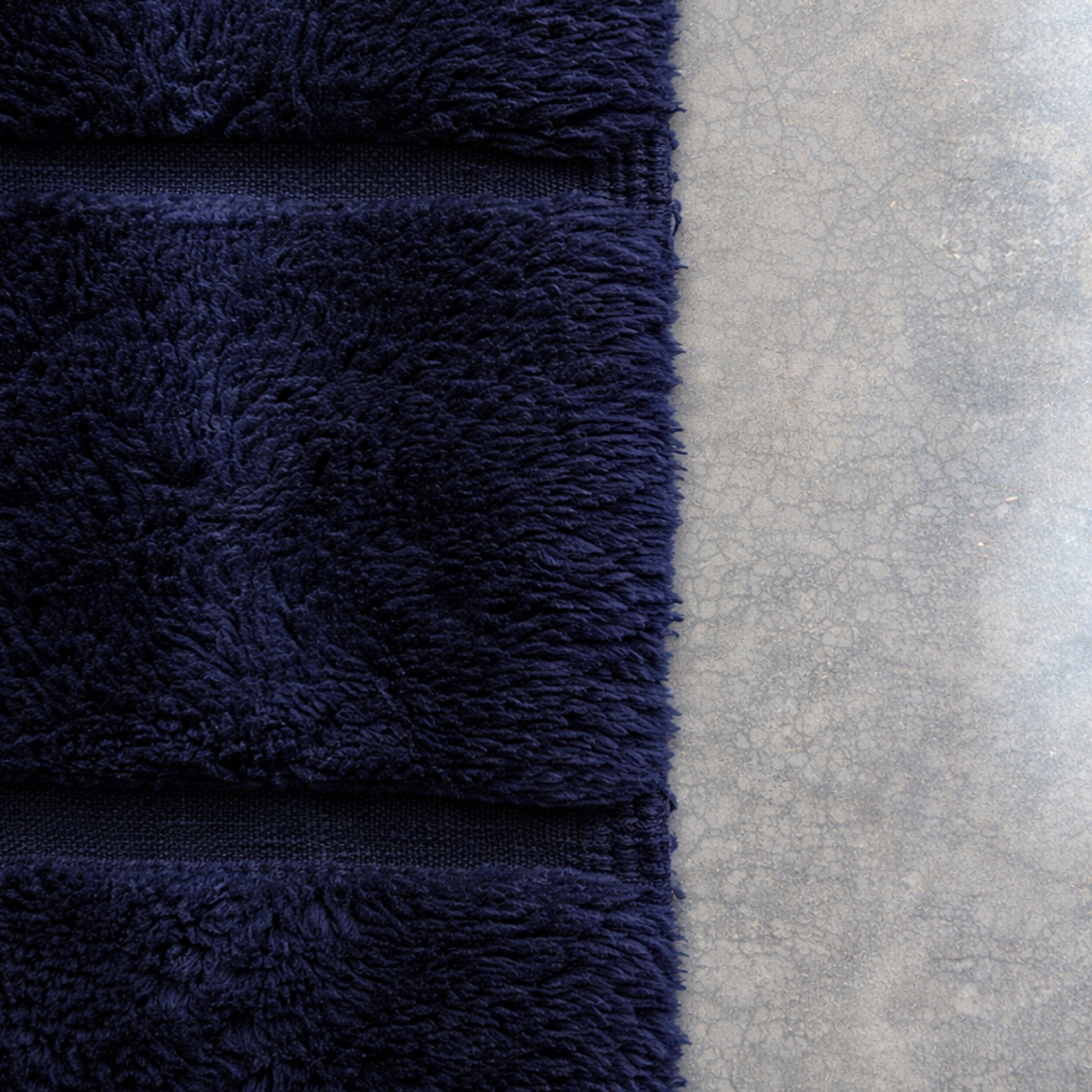Top view of Linea Moroccan runner rug highlighting subtle horizontal bands and tonal texture in navy wool.