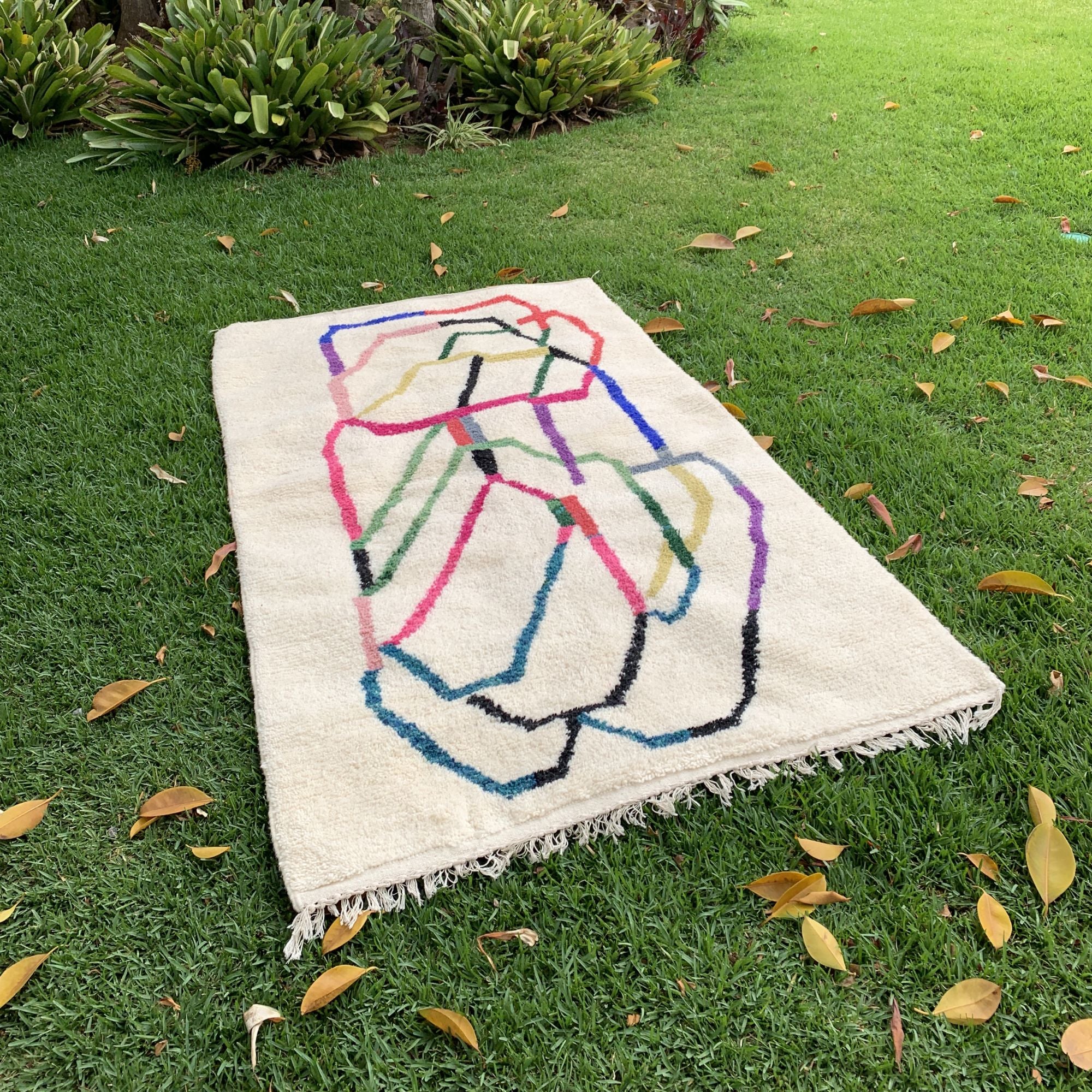 Tranquil Trails white Moroccan rug with colorful contemporary design, handwoven by Berber artisans.