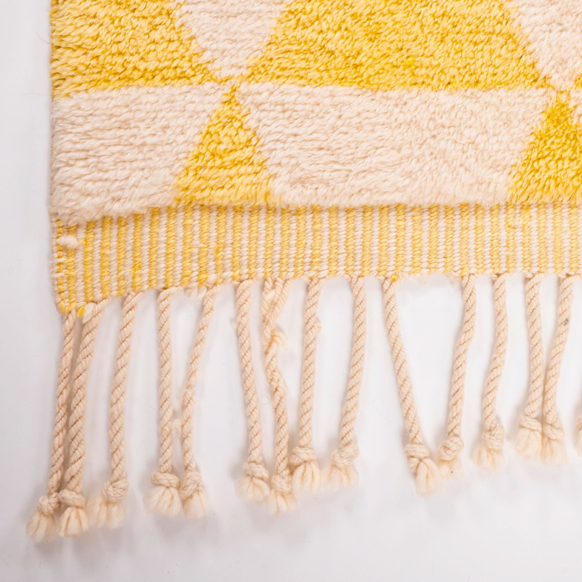 Ancient Whispers yellow Moroccan rug with a white base and yellow triangle design, handwoven by Berber artisans