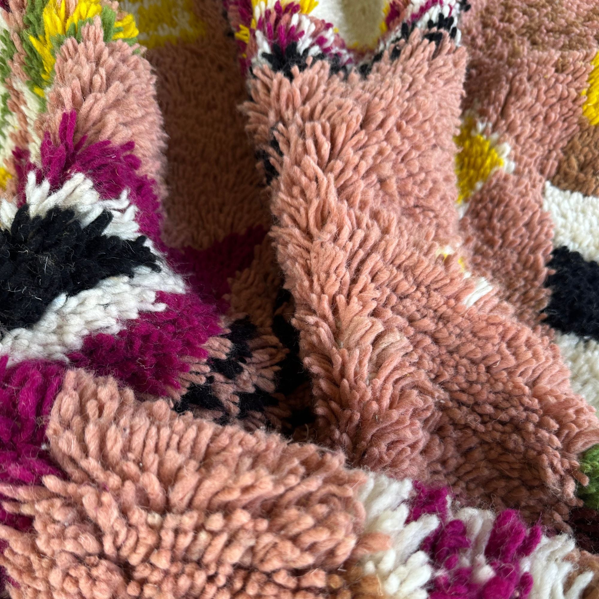 Artisan Treasures pink Moroccan rug with colorful Berber diamond tribal designs and textured sides, handwoven by Berber artisans.