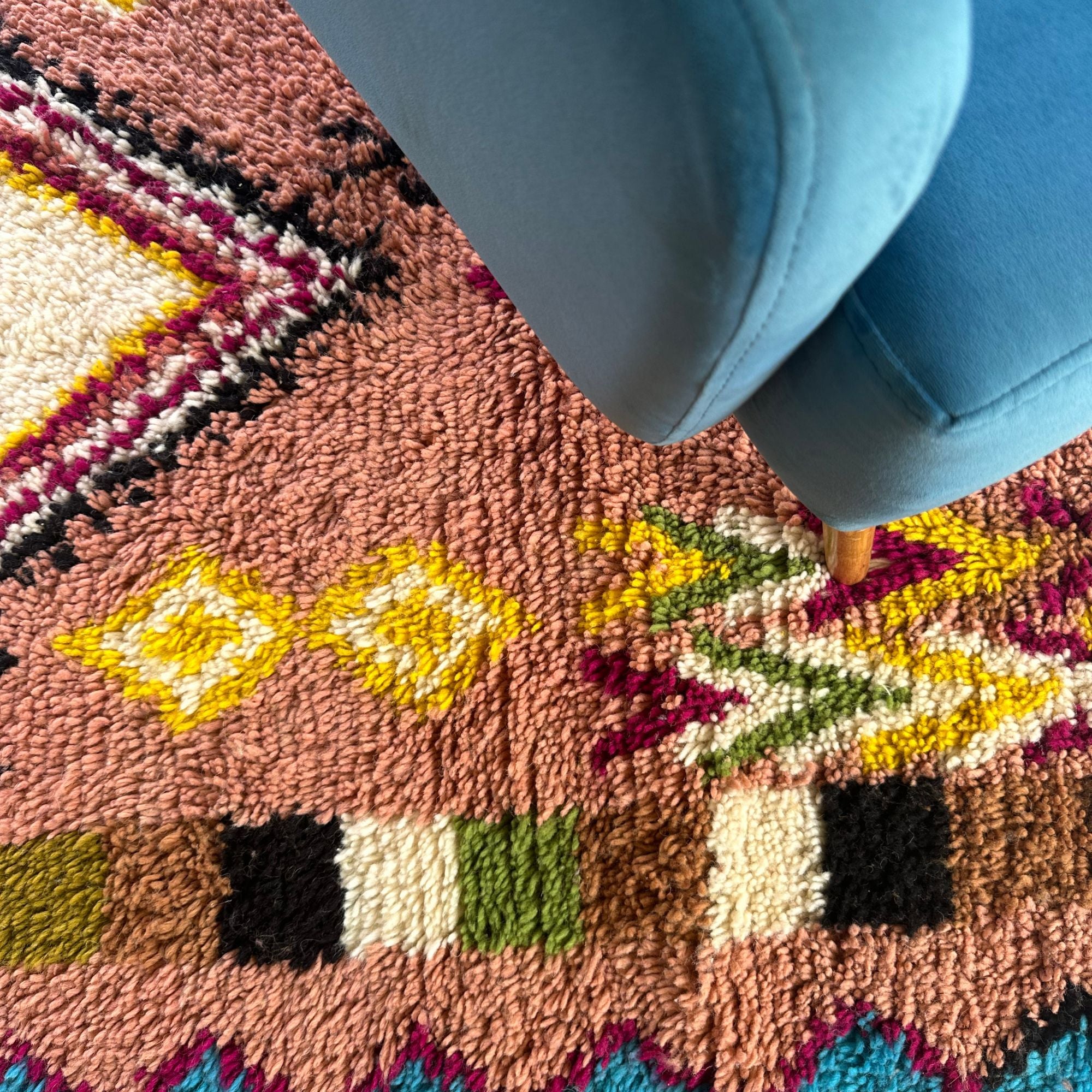 Artisan Treasures pink Moroccan rug with colorful Berber diamond tribal designs and textured sides, handwoven by Berber artisans.