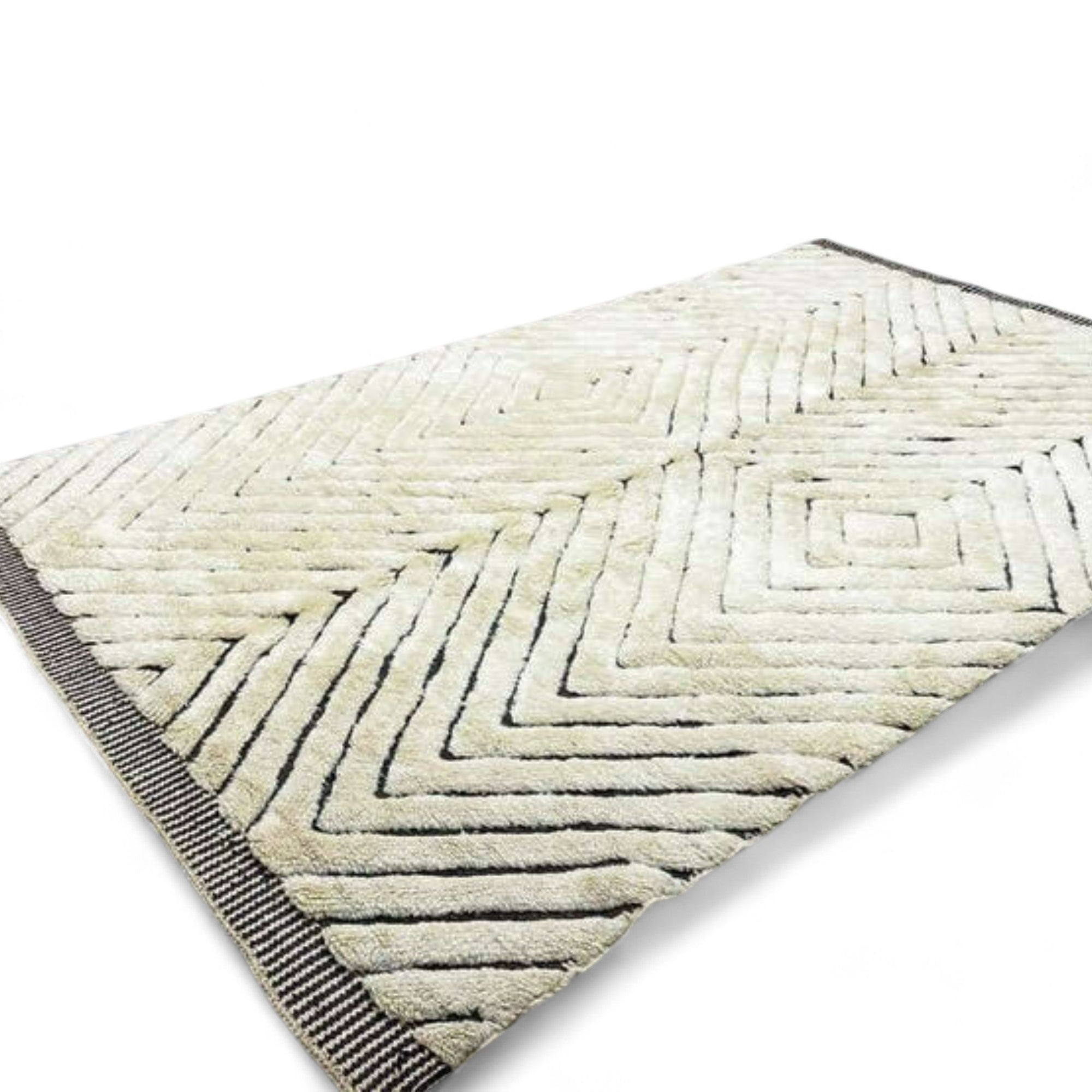 Berber Boulevards white Moroccan rug with a textured black diamond design, handwoven by Berber artisans.