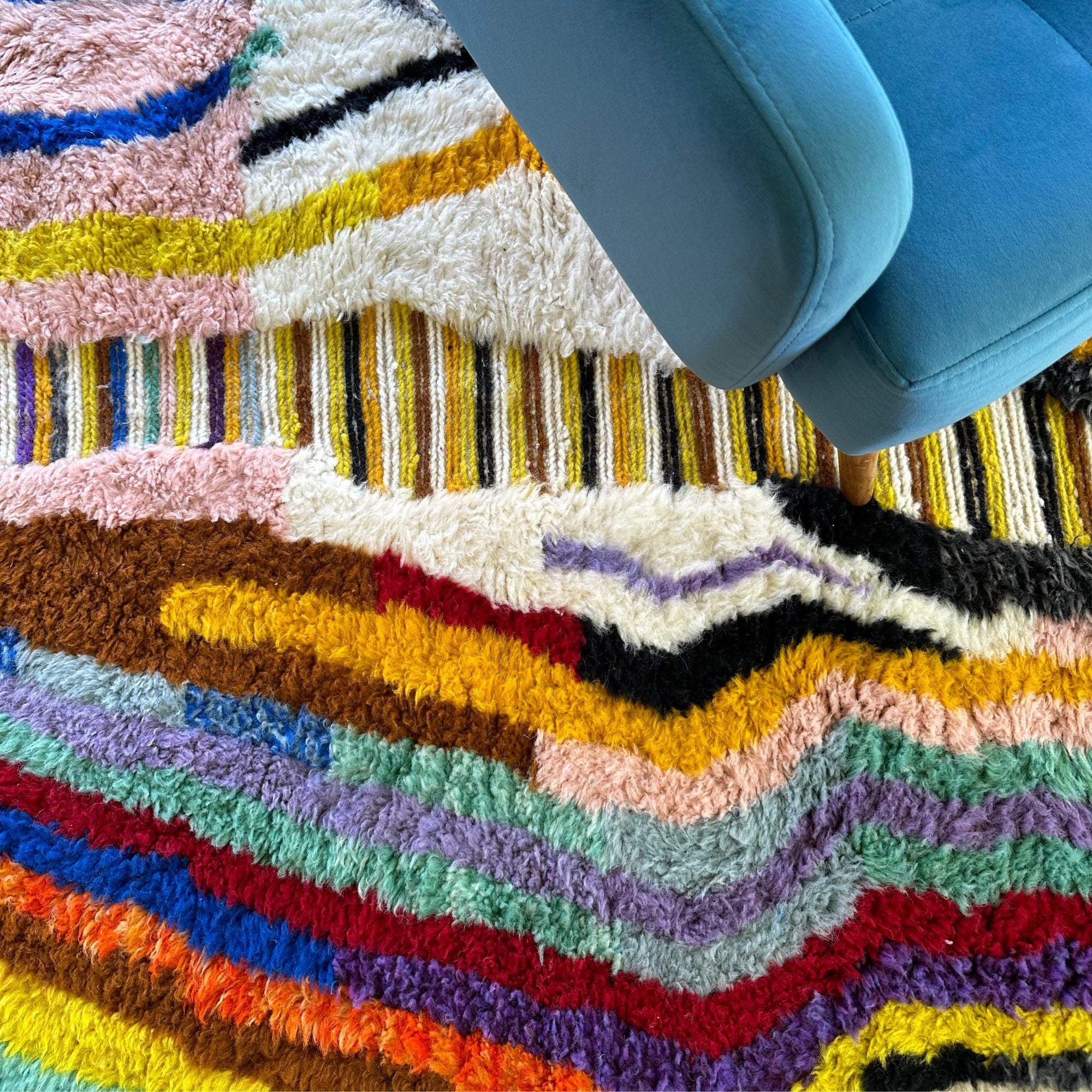 Berber Odyssey Berber area rug with a vibrant multicolor and textured design, handwoven by Berber artisans