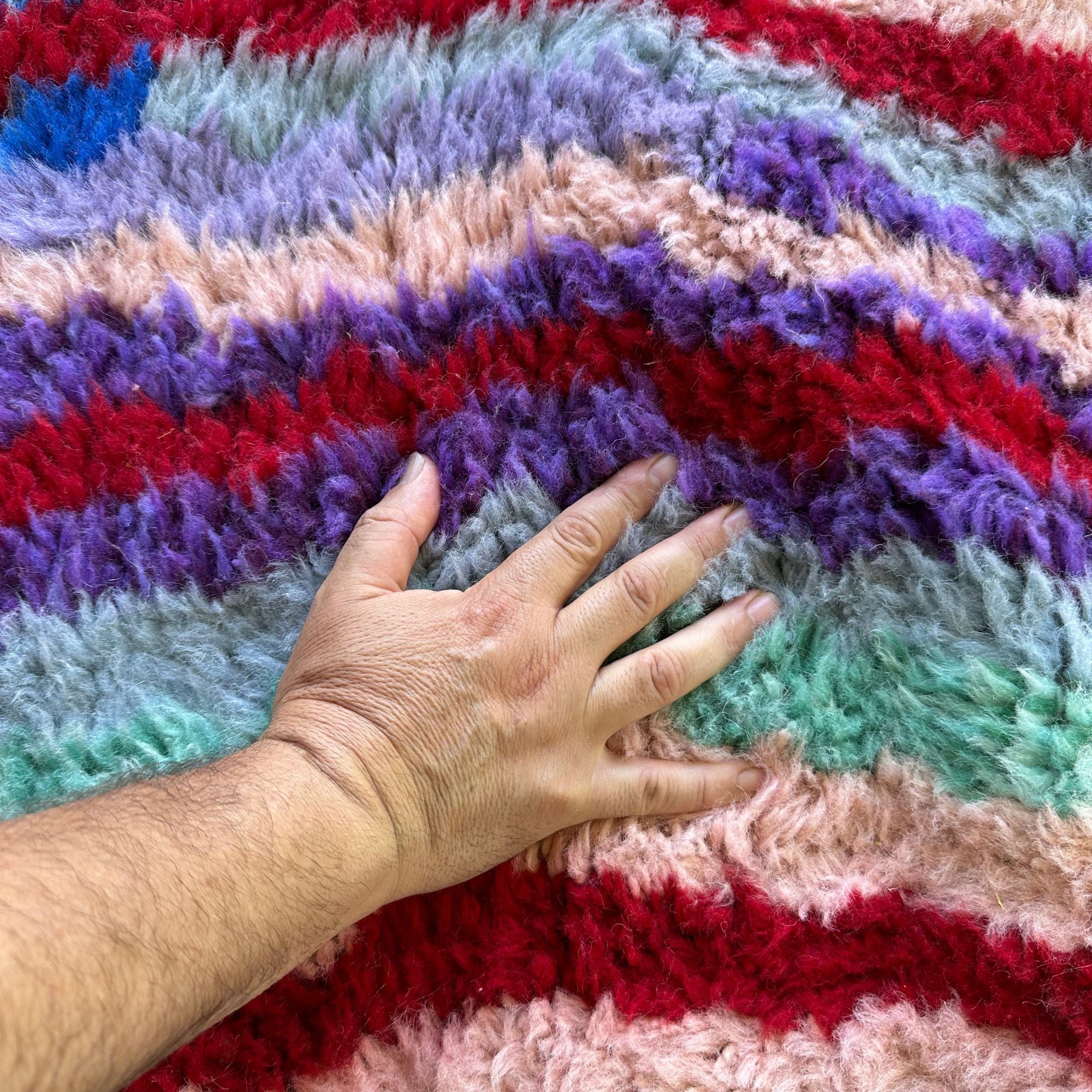Berber Odyssey Berber area rug with a vibrant multicolor and textured design, handwoven by Berber artisans