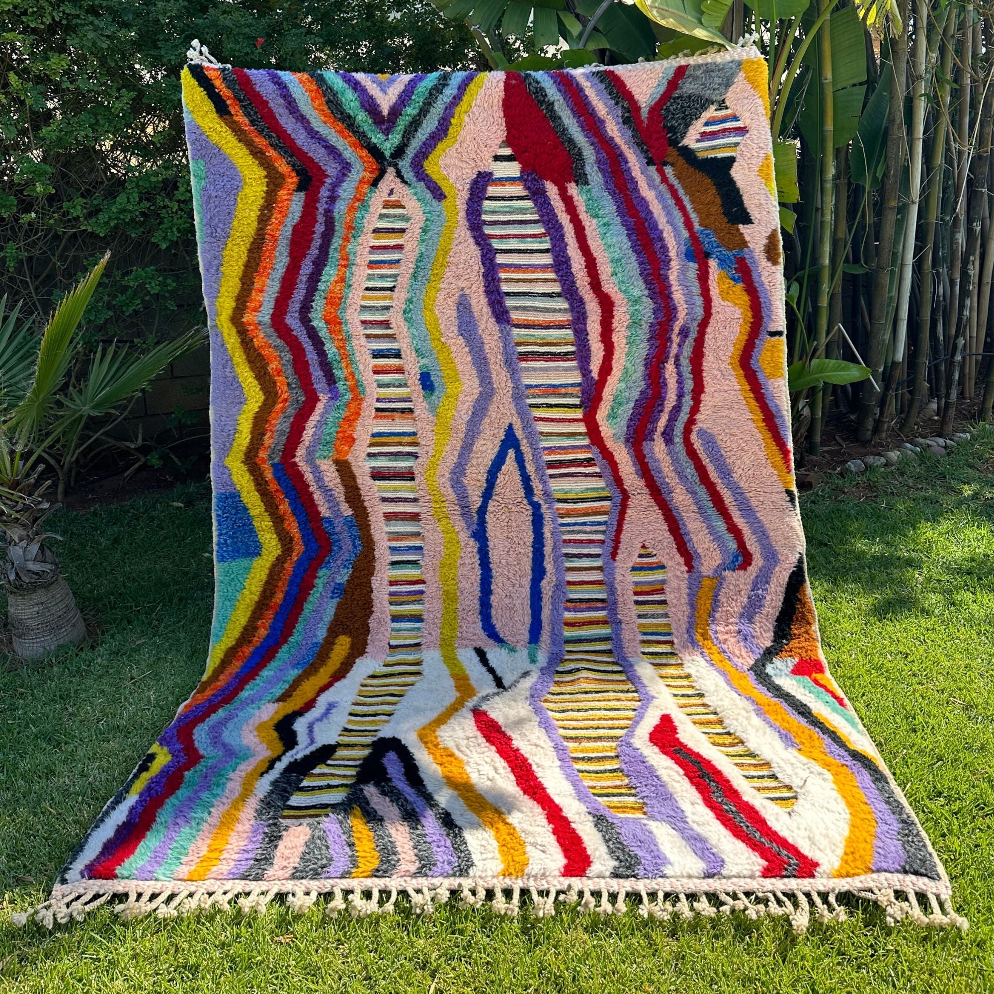 Berber Odyssey Berber area rug with a vibrant multicolor and textured design, handwoven by Berber artisans