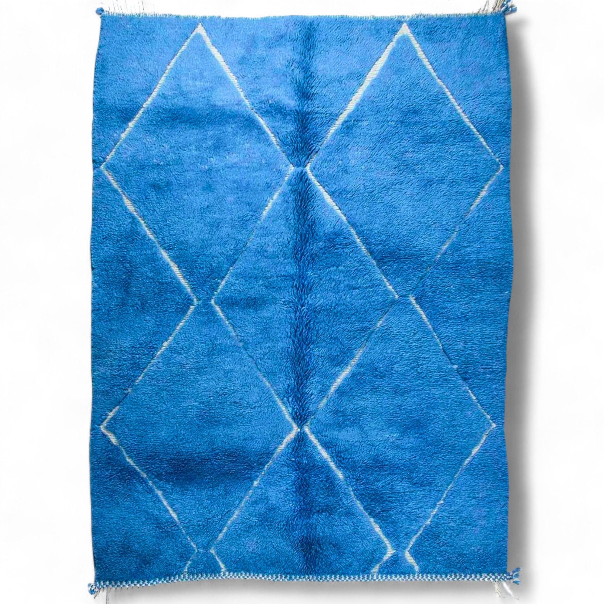 Artisan Essence blue Moroccan rug with a white diamond design, handwoven by Berber artisans