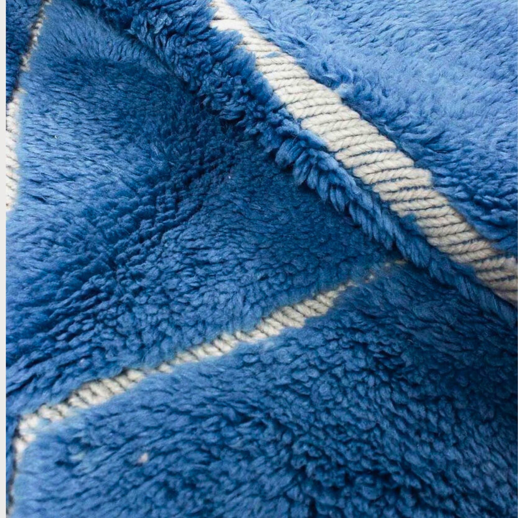 Artisan Essence blue Moroccan rug with a white diamond design, handwoven by Berber artisans