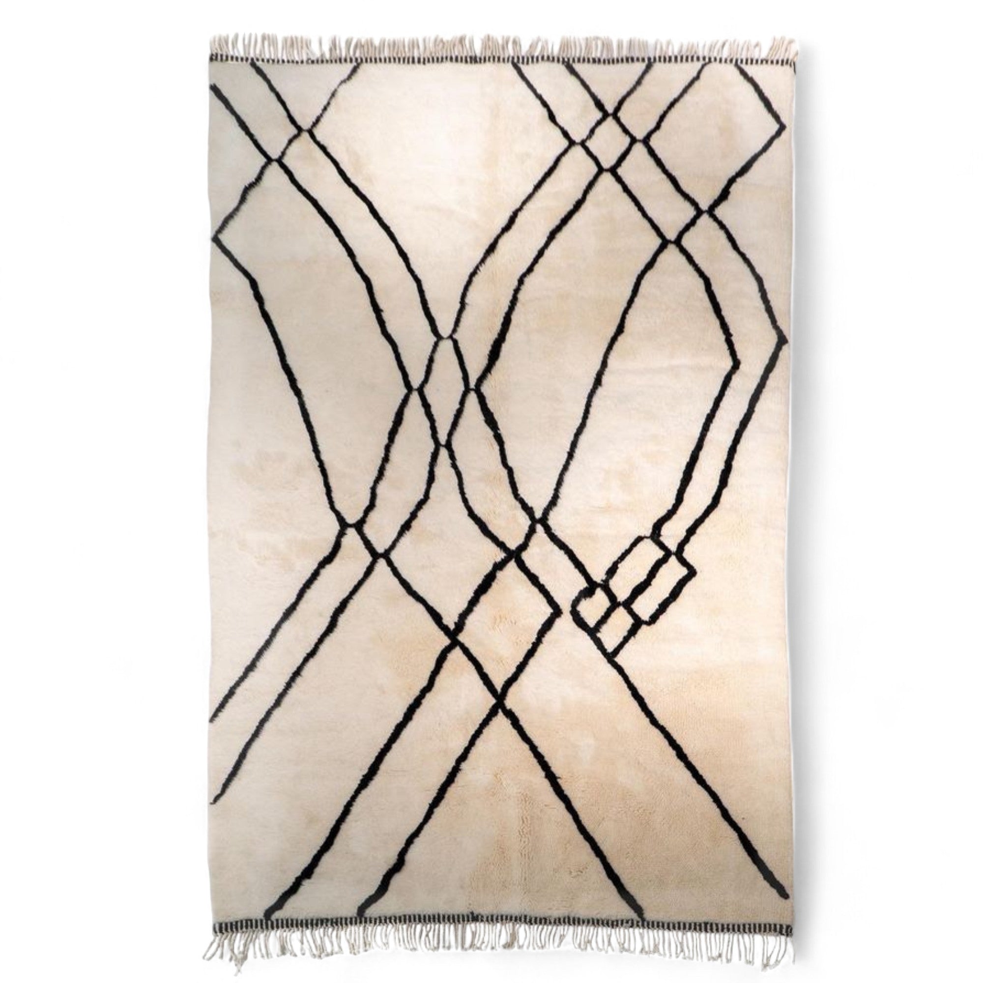 Berber Tradition white Moroccan rug with a black tribal design, handwoven by Berber artisans