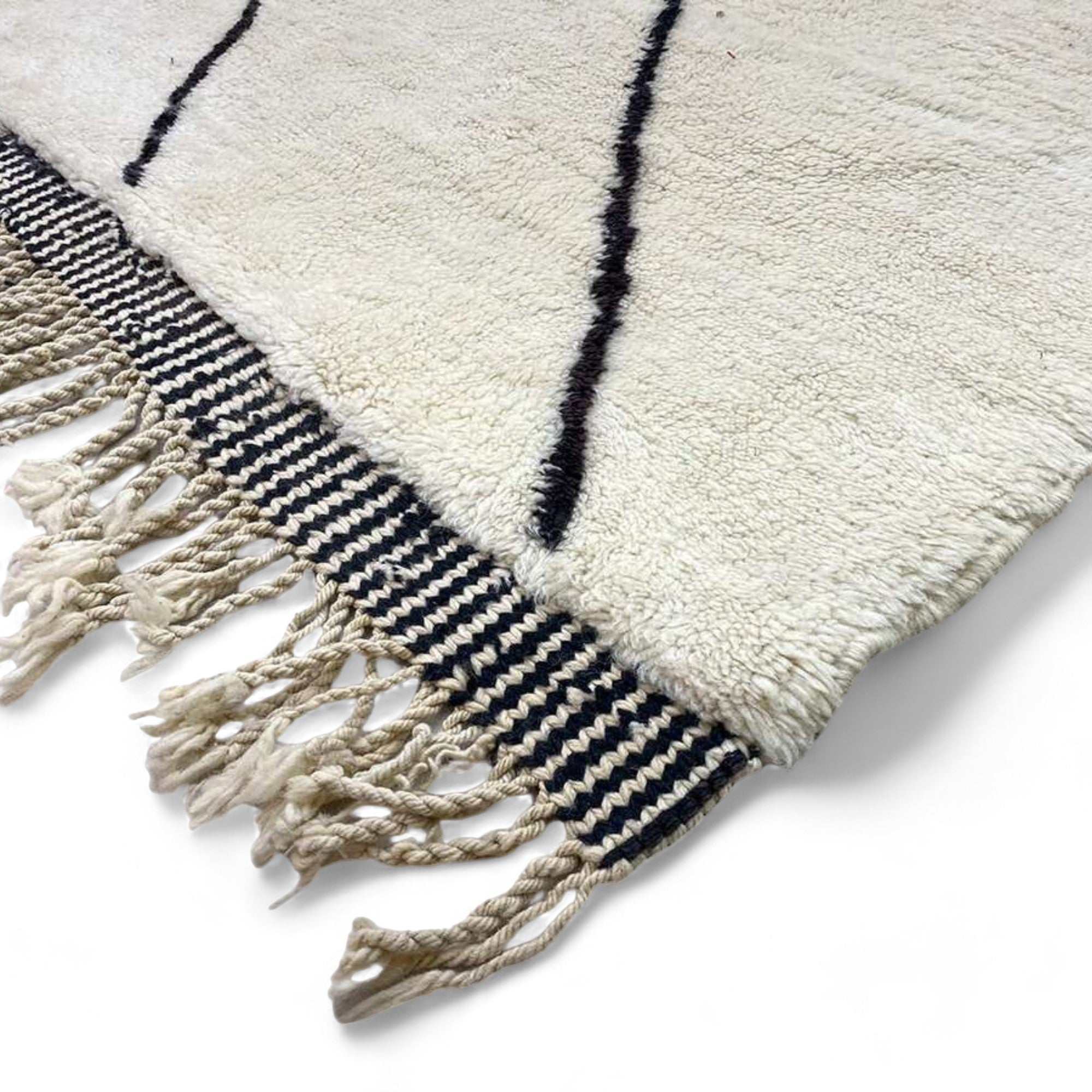 Berber Tradition white Moroccan rug with a black tribal design, handwoven by Berber artisans