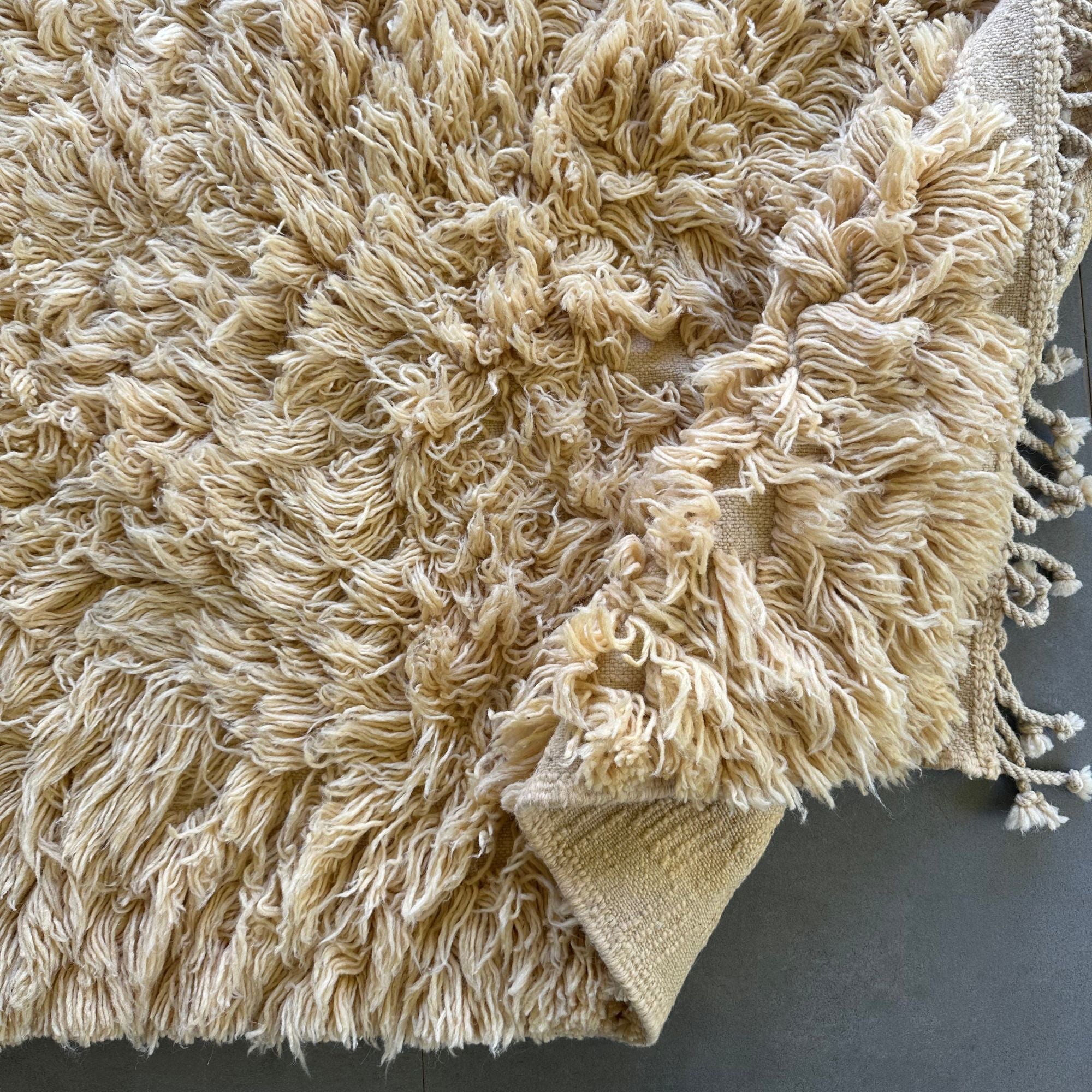 Celestial Charm high pile Moroccan rug with a cream color and hidden textured design, handwoven by Berber artisans