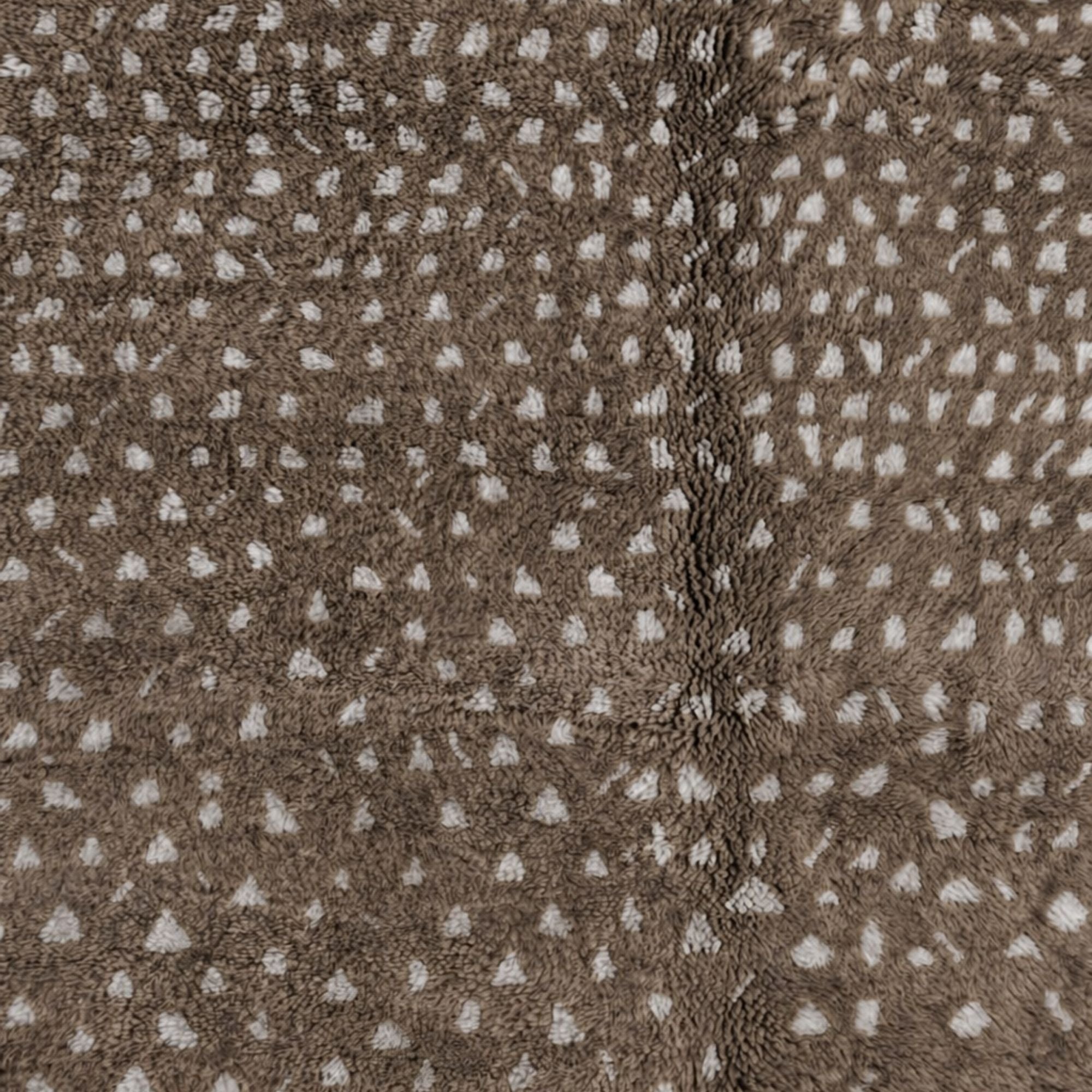 Close-up of Atelier No. 01 Moroccan rug showing soft brown wool pile with hand-knotted ivory dot motifs.