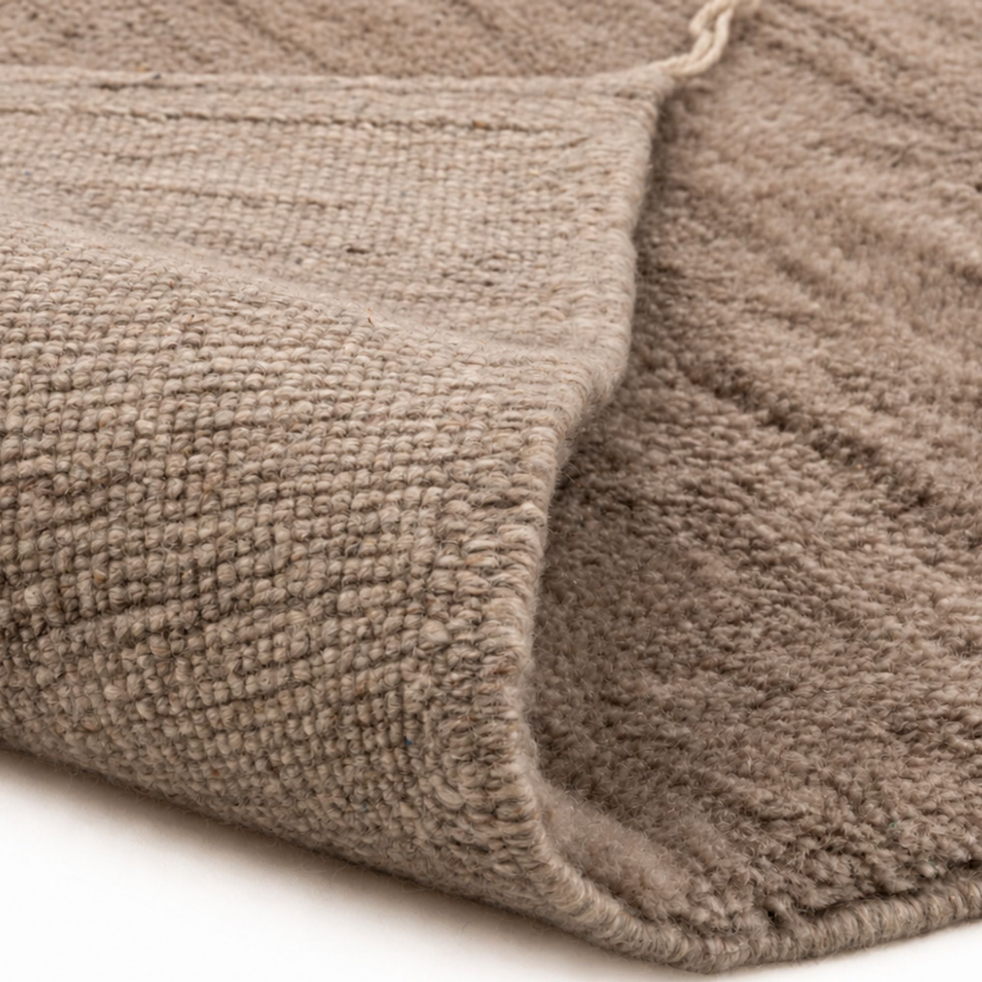 Close-up of Moroccan wool rug showing dense weave and plush texture, warm taupe handmade Beni Mrirt rug detail