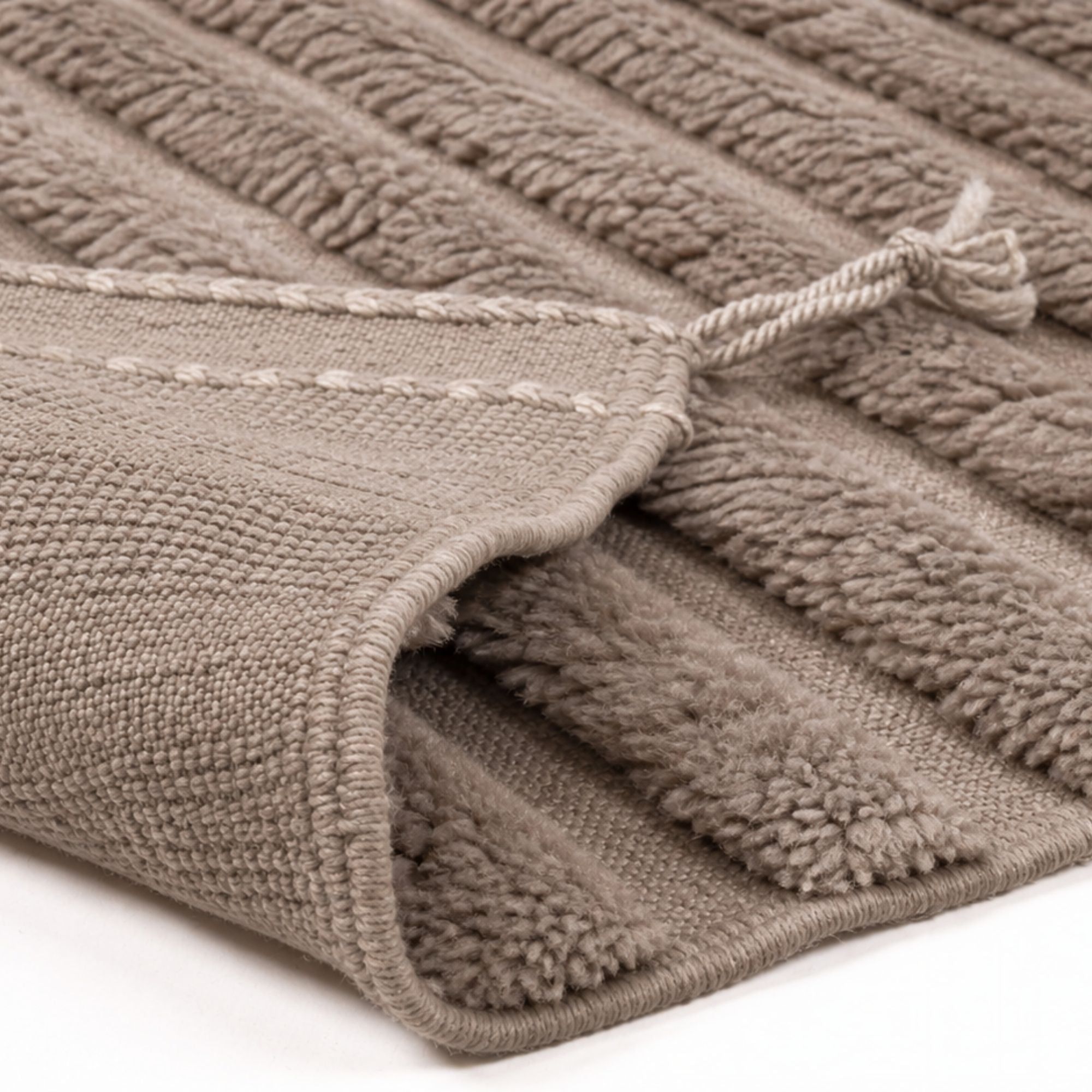 Close-up of Strata No. 03 textured Moroccan wool rug showing raised pile and handwoven flatweave construction