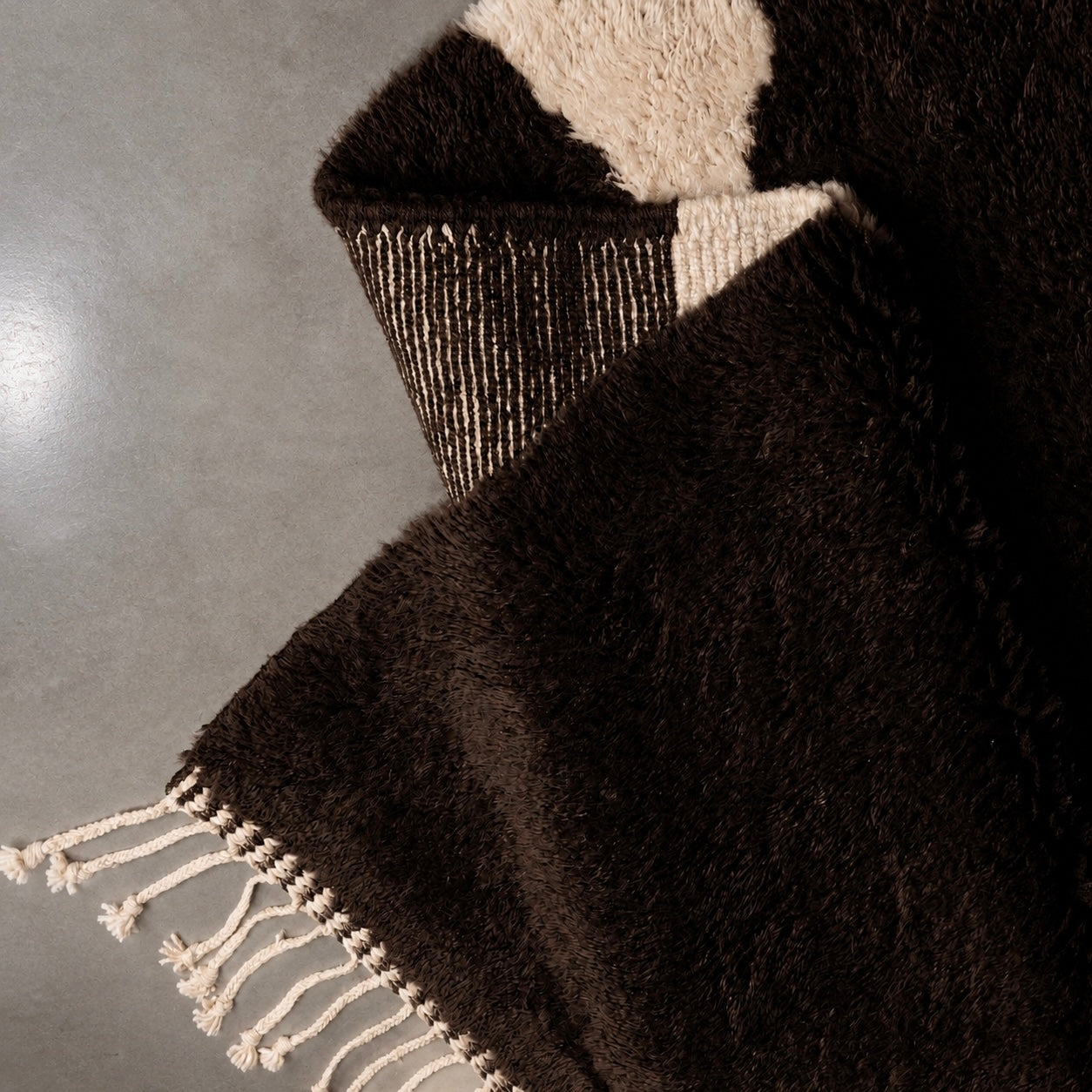 Corner detail of Fragment No. 01 revealing handwoven construction, natural wool texture, and artisan craftsmanship.