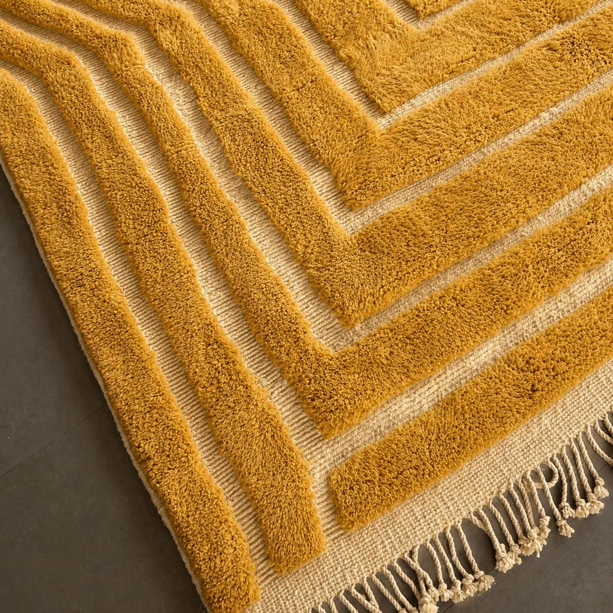 Corner detail of Sahara Symphony No. 02 highlighting the raised geometric wool pattern, natural flatweave base, and handmade Moroccan craftsmanship.