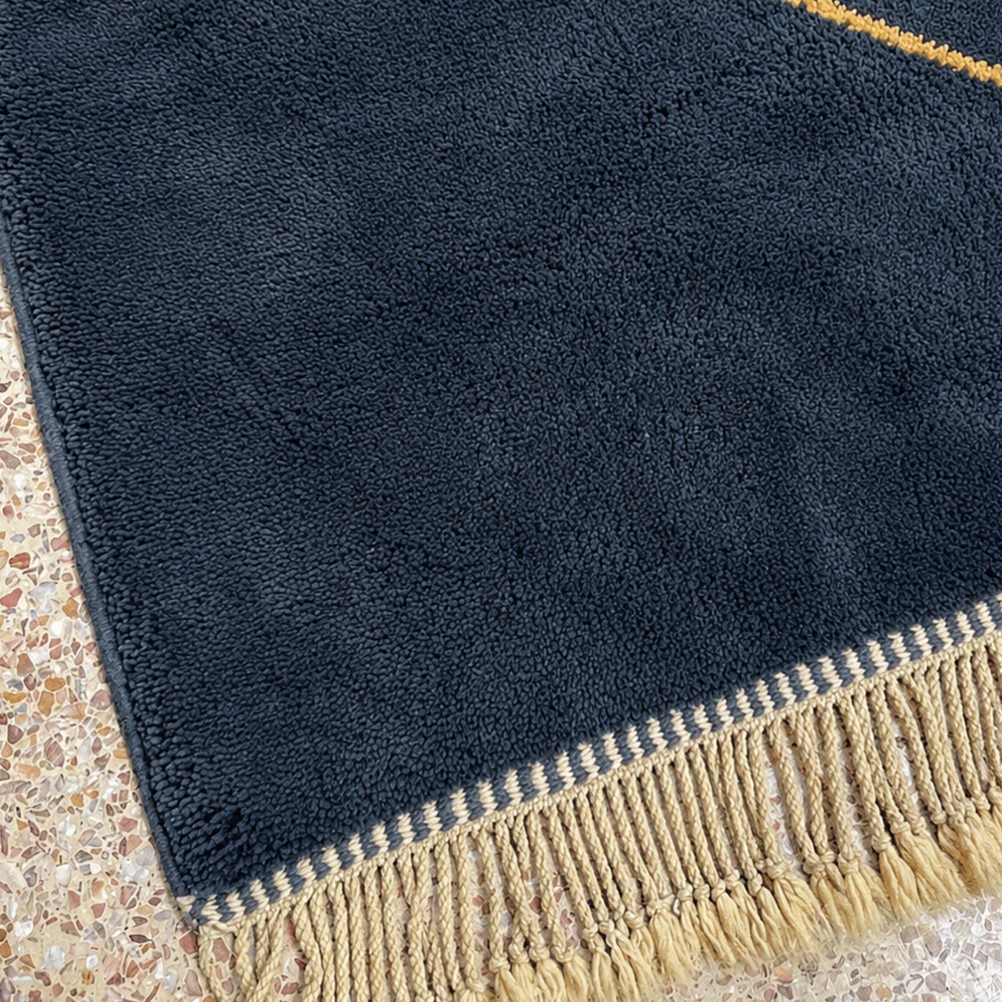 Dense wool pile and hand-finished fringe on blue Moroccan rug
