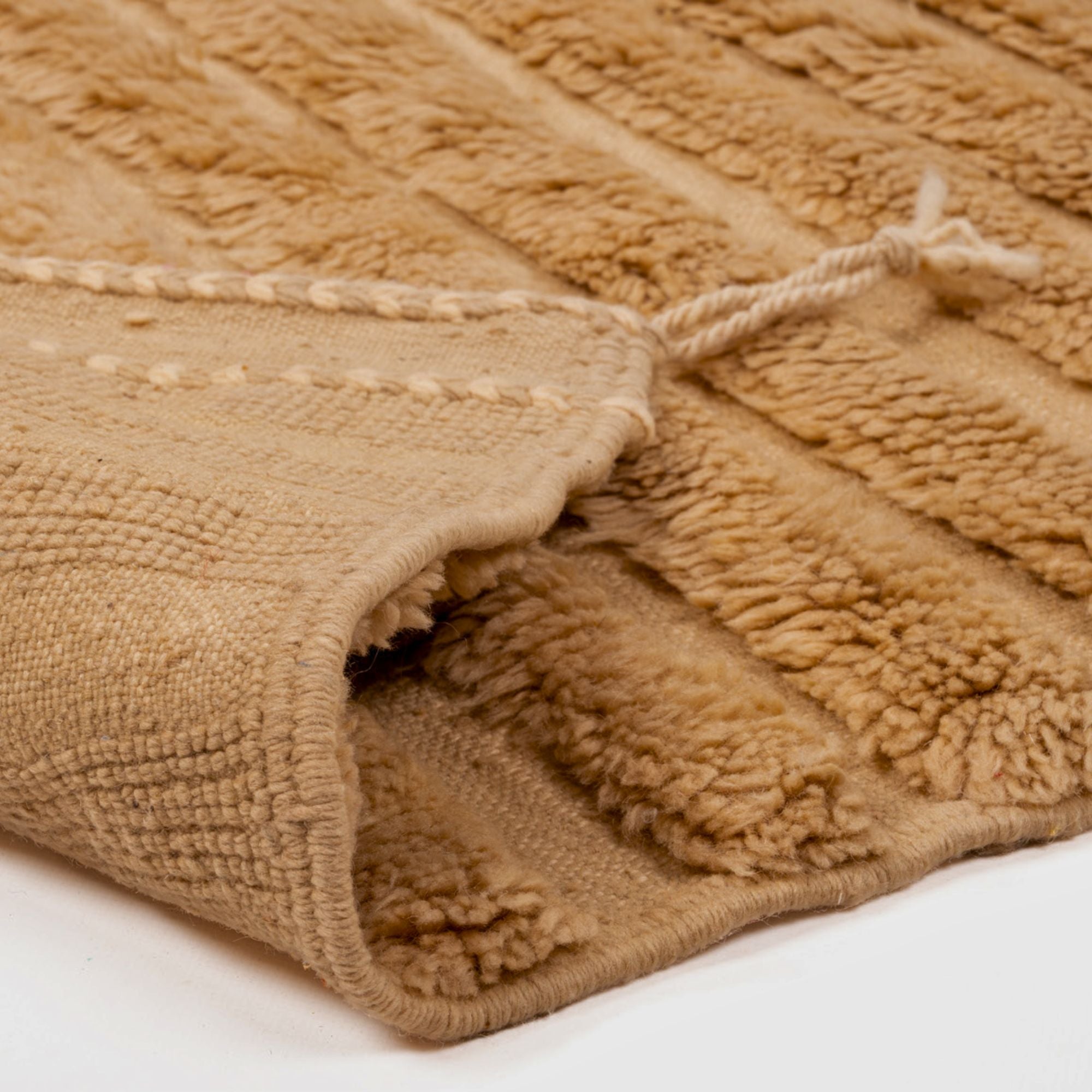 Desert Elegance brown Berber rug with a textured design, handwoven by Berber artisans