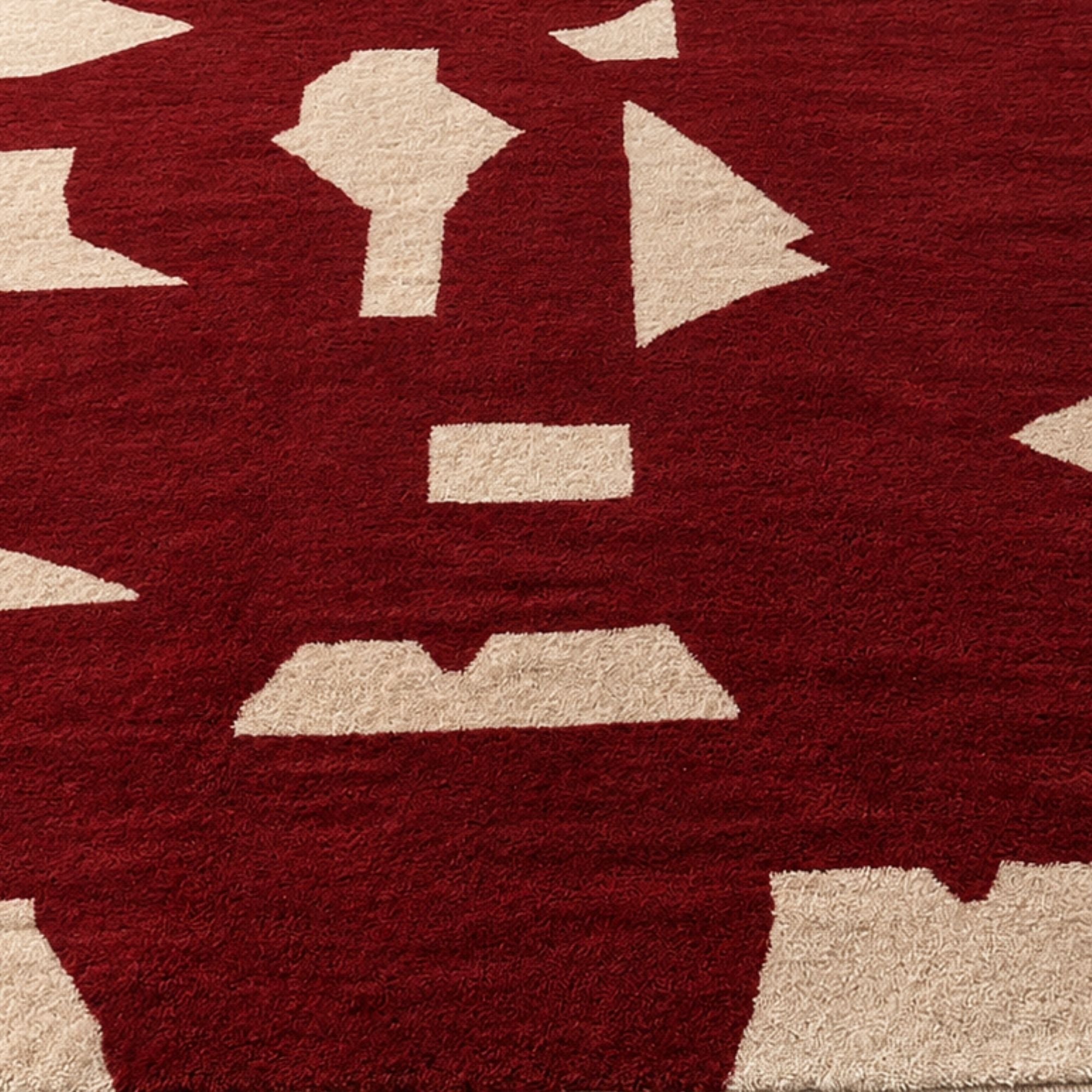 Detail of Fragment No. 02 handmade Moroccan wool rug shown at an angle with scattered ivory fragment pattern.