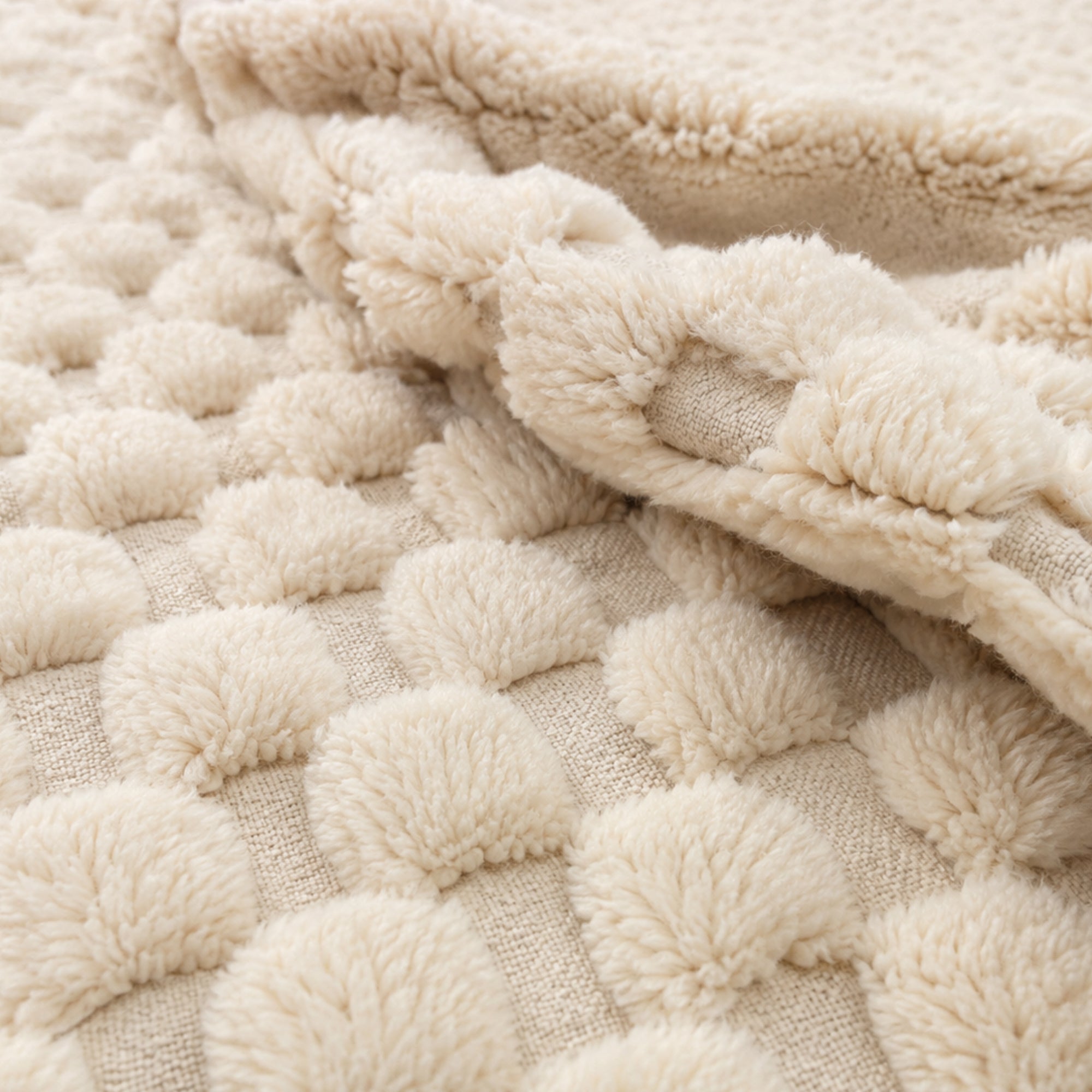Detail of Interval handmade Moroccan wool rug folded to show raised weave and natural wool backing.