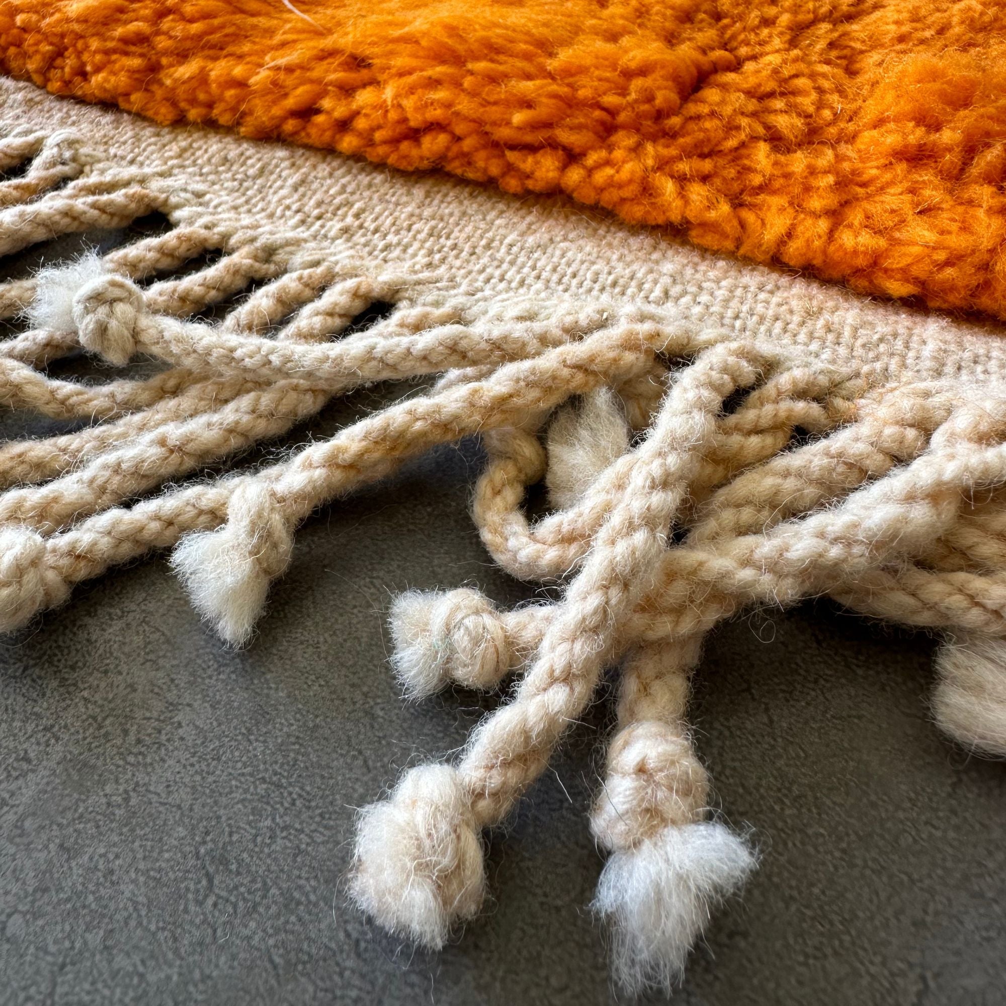 Enchanted Echo 3 foot wide runner rug with an orange and white color scheme and a tribal Berber design in the middle, handwoven by Berber artisans