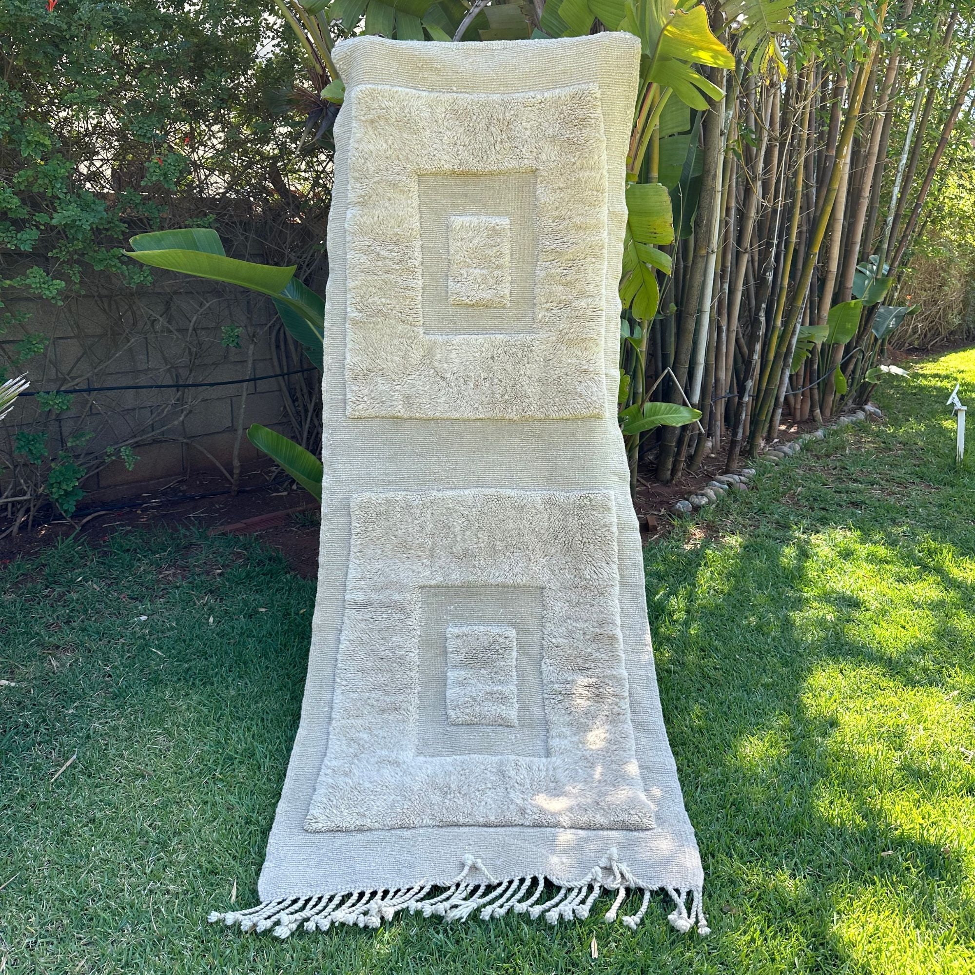 Enchanted Echo Berber area rug with a textured design featuring two larger squares with smaller squares inside, handwoven by Berber artisans