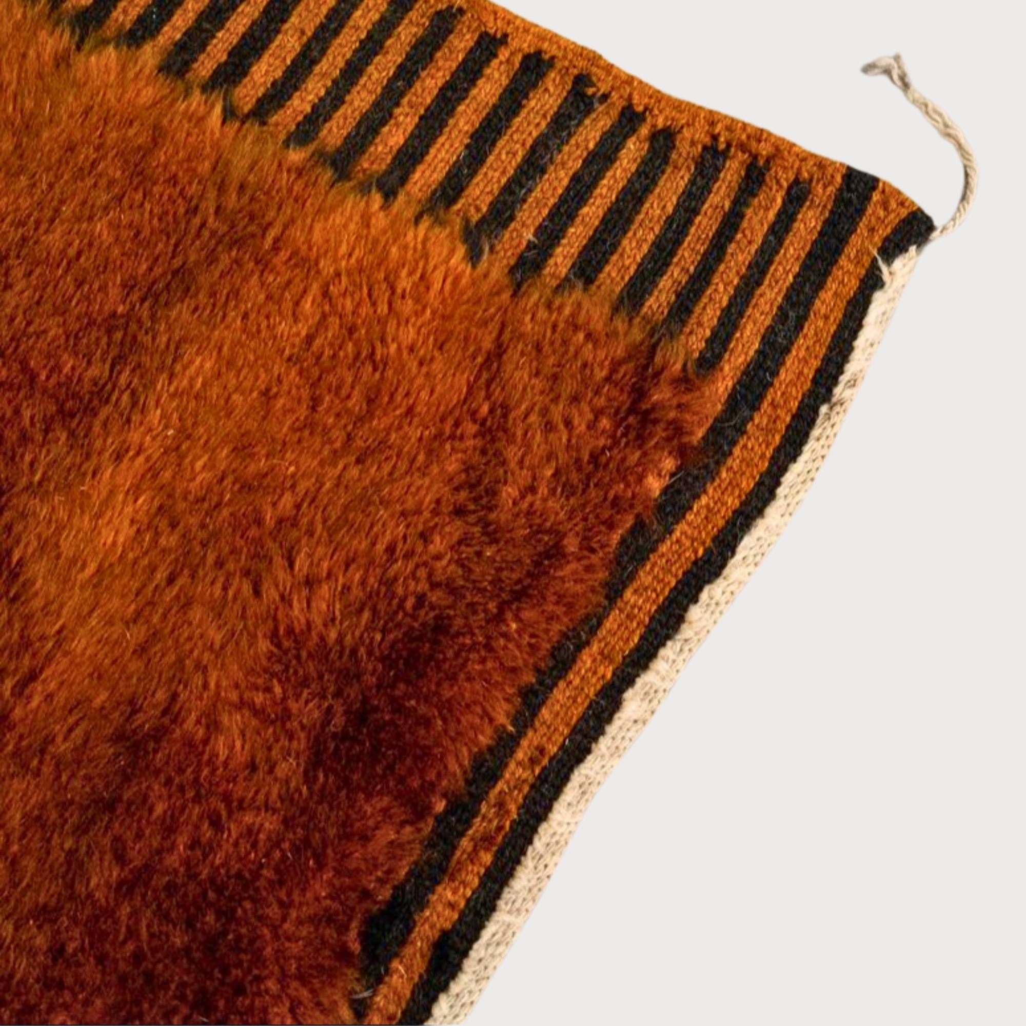 Ethereal Embrace high pile Moroccan rug with a brown base, black stripes, and flat edges, handwoven by Berber artisans