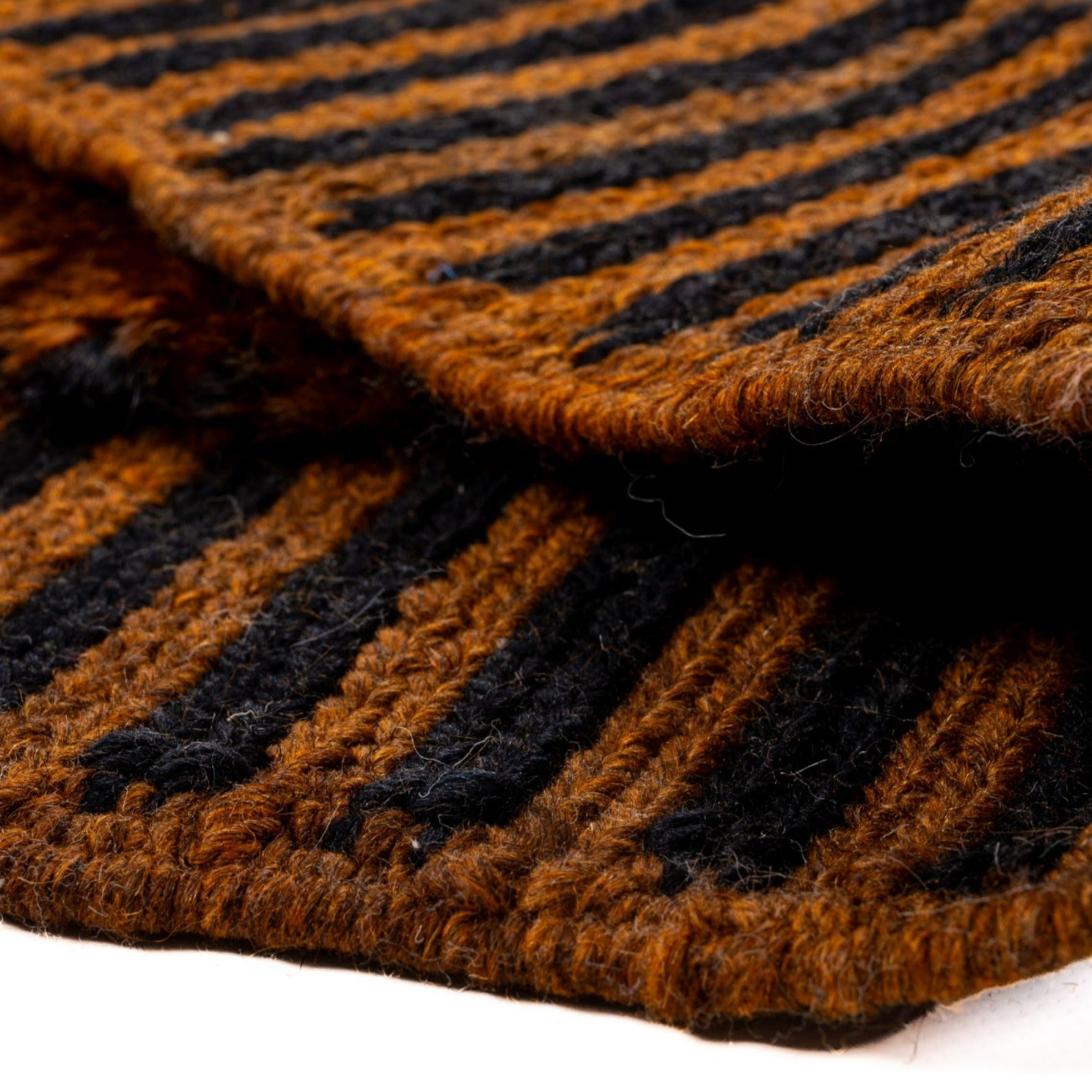 Ethereal Embrace high pile Moroccan rug with a brown base, black stripes, and flat edges, handwoven by Berber artisans