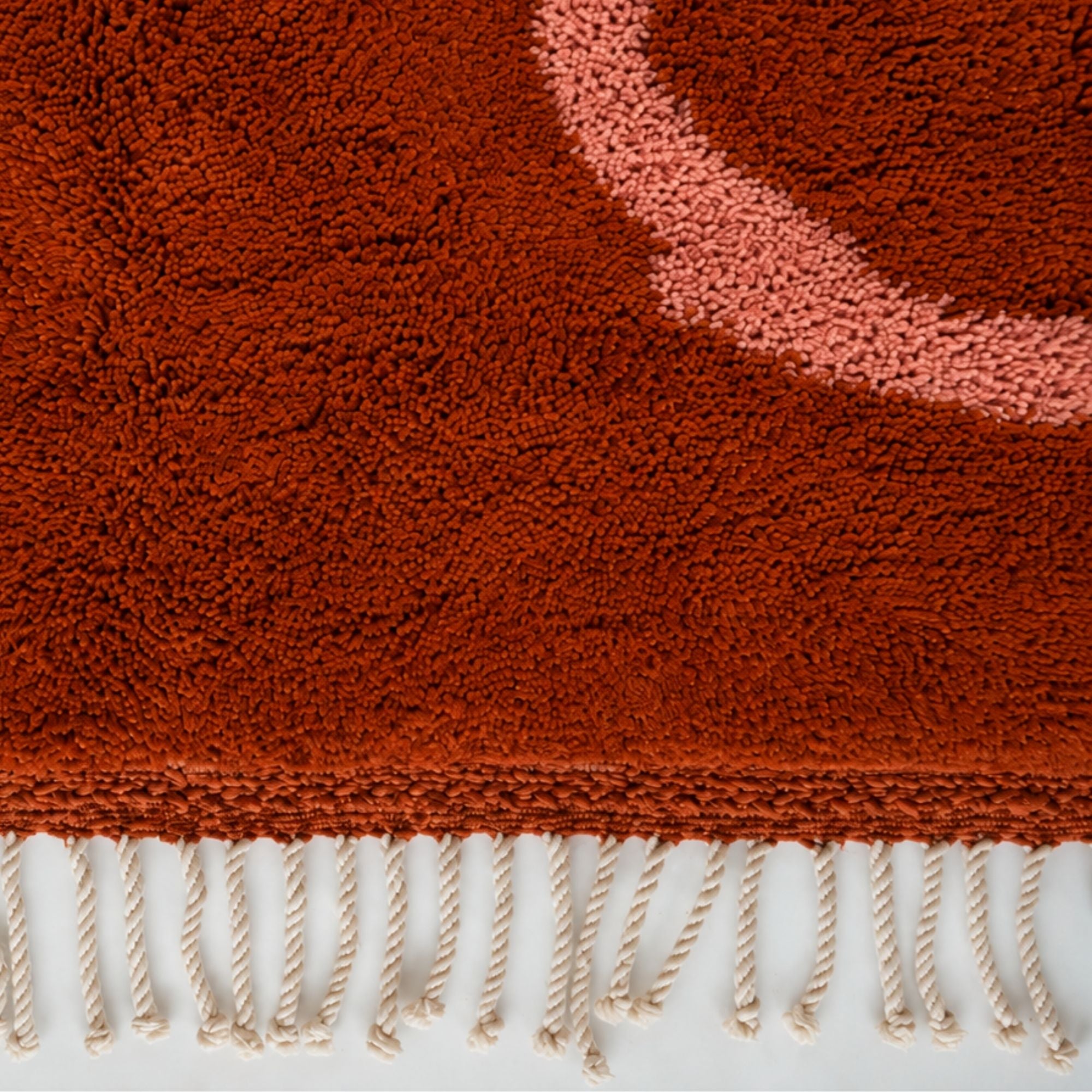Hand-finished ivory fringe on Marea No. 01 terracotta Moroccan rug