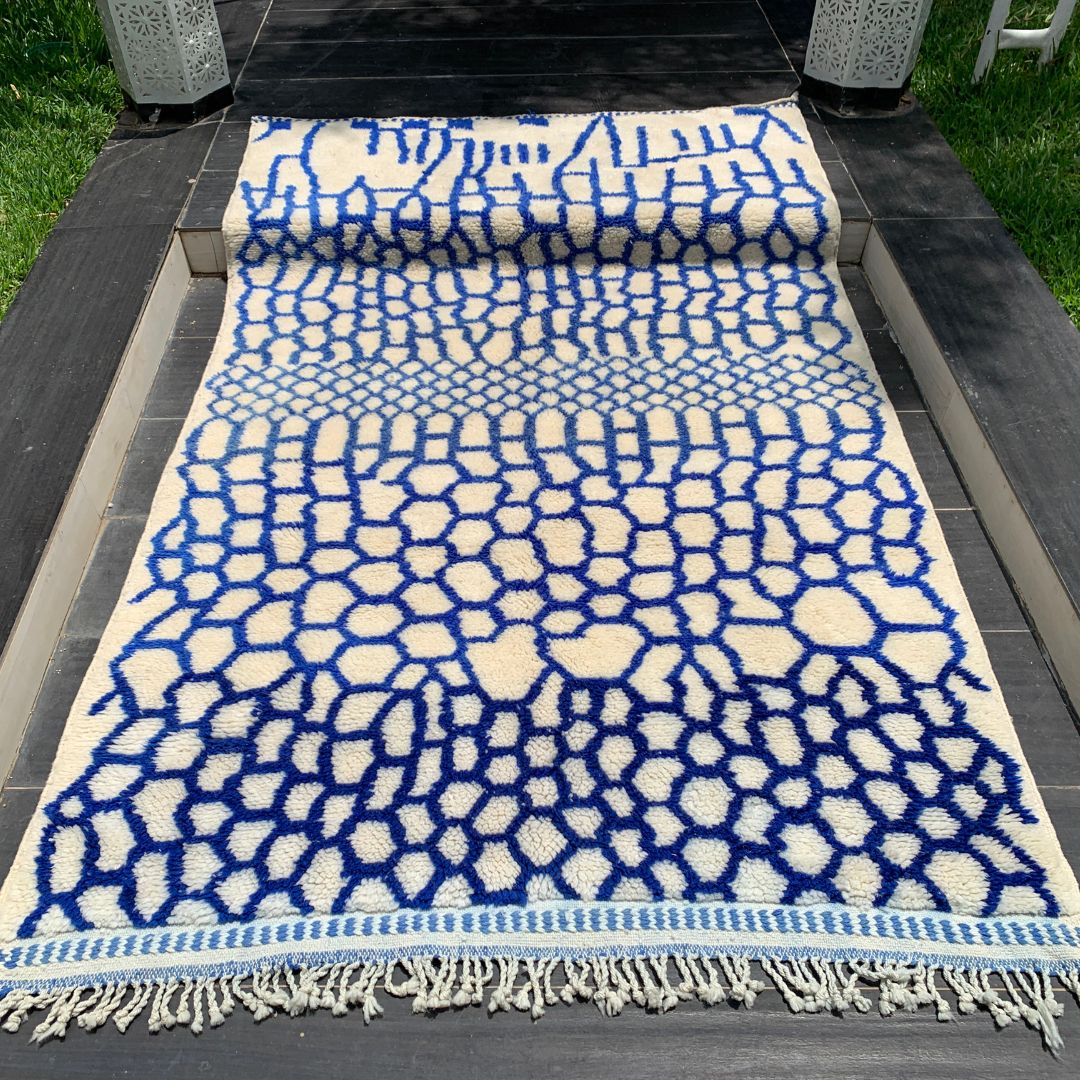 Whispering Willow Moroccan shag rug with a blue honeycomb design, handwoven by Berber artisans