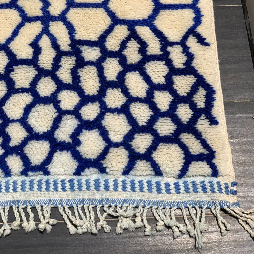 Whispering Willow Moroccan shag rug with a blue honeycomb design, handwoven by Berber artisans