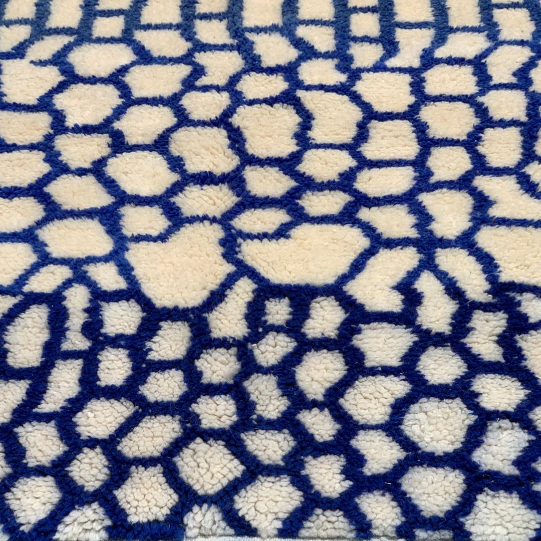 Whispering Willow Moroccan shag rug with a blue honeycomb design, handwoven by Berber artisans