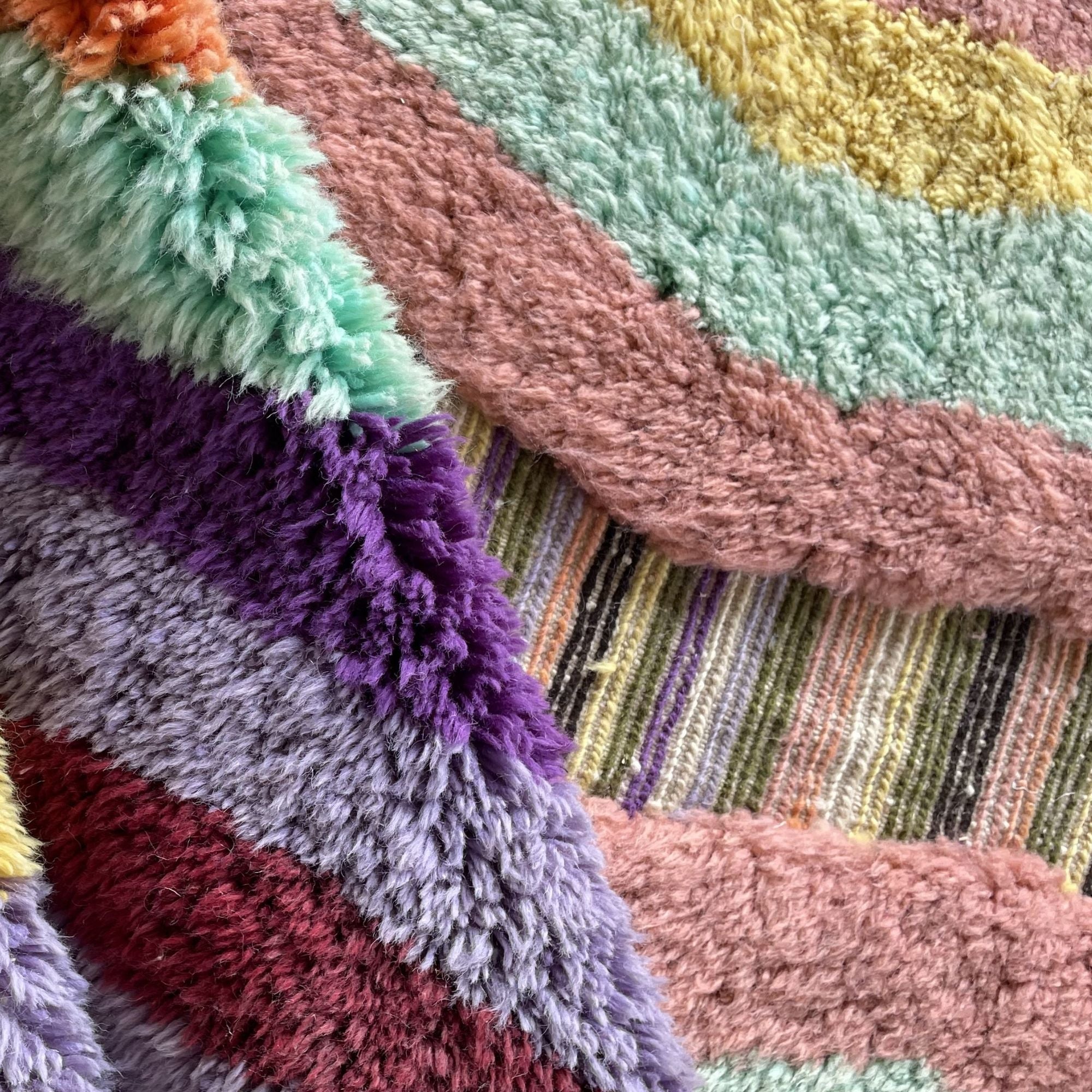Handwoven Moroccan wool rug, Chorus design, close-up of vertical stripe colors and pile texture.